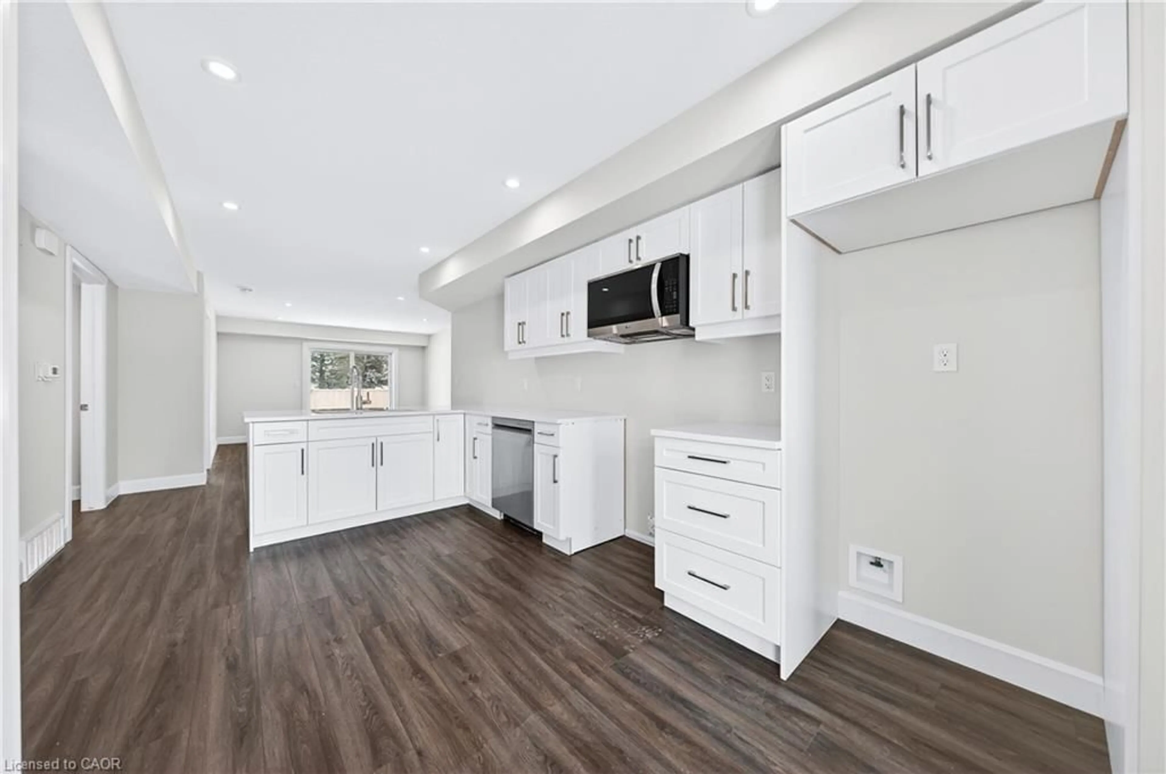 Open concept kitchen, wood/laminate floor for 3202 Vivian Line #47, Stratford Ontario N5A 0K6