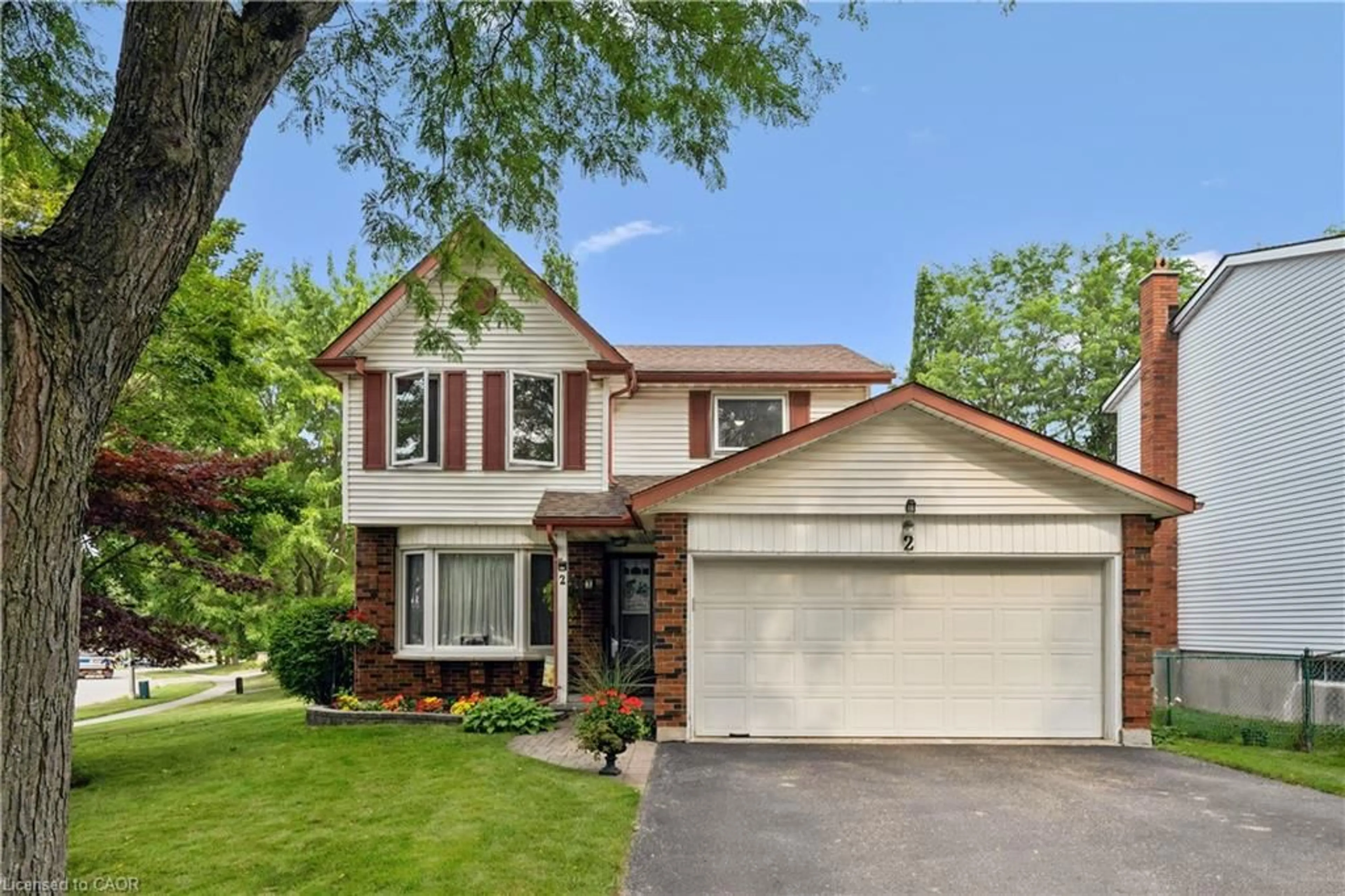 Home with vinyl exterior material, street for 2 Woodborough Rd, Guelph Ontario N1G 3K5