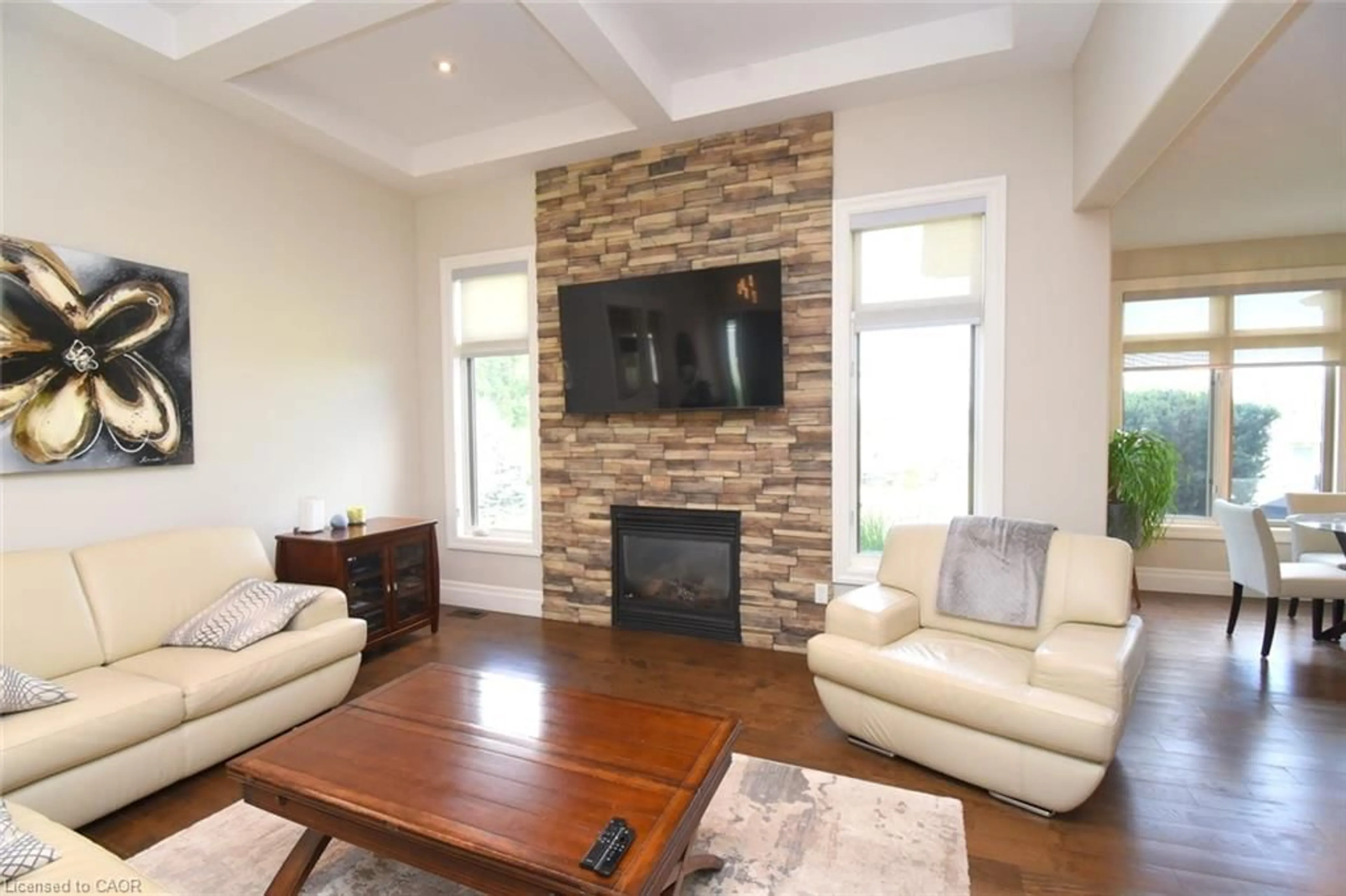 Living room with furniture, wood/laminate floor for 1 Ellington Pl, Brantford Ontario N3T 5L7