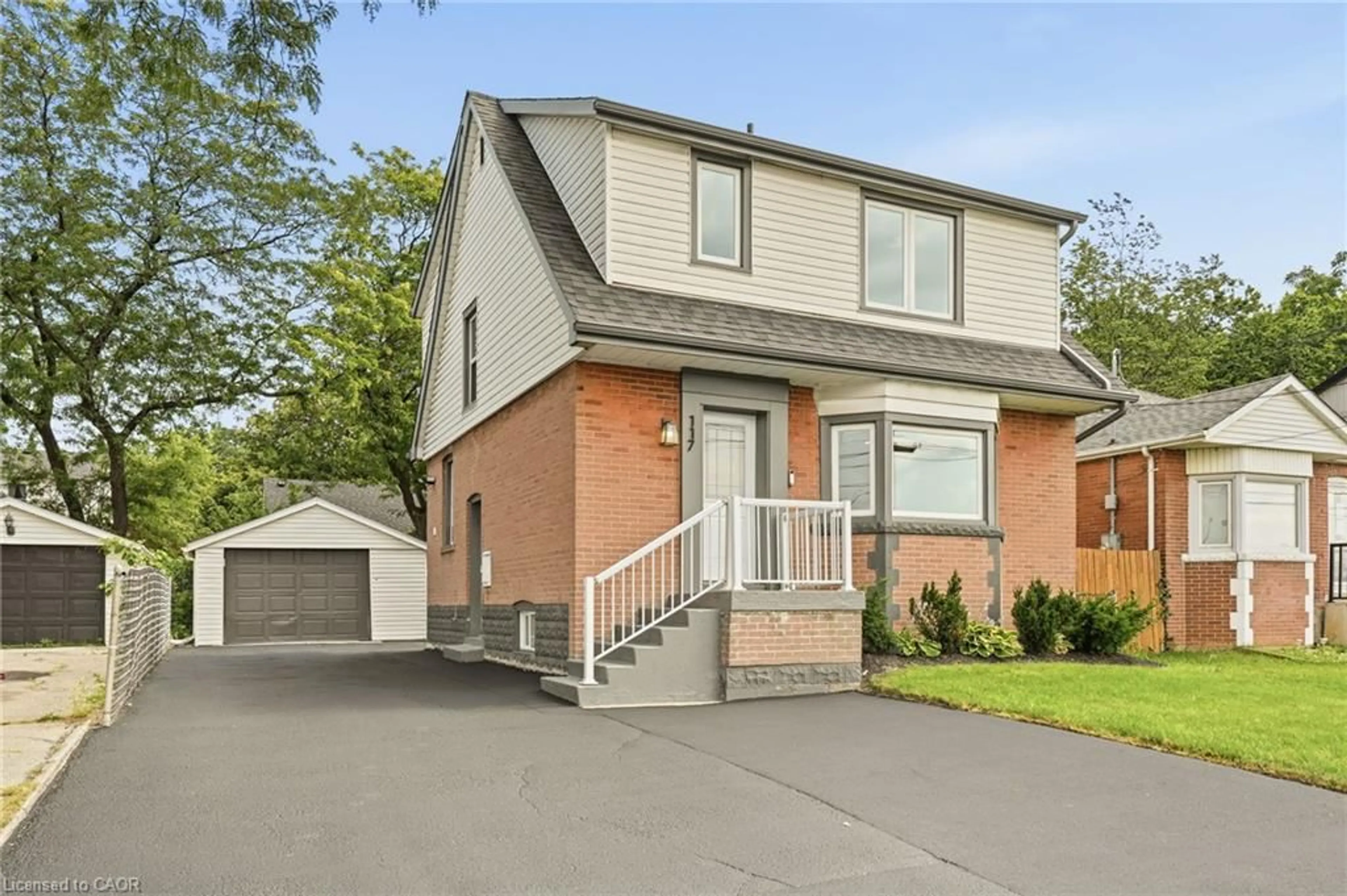 Home with brick exterior material, street for 117 West 5th St, Hamilton Ontario L9C 3N7