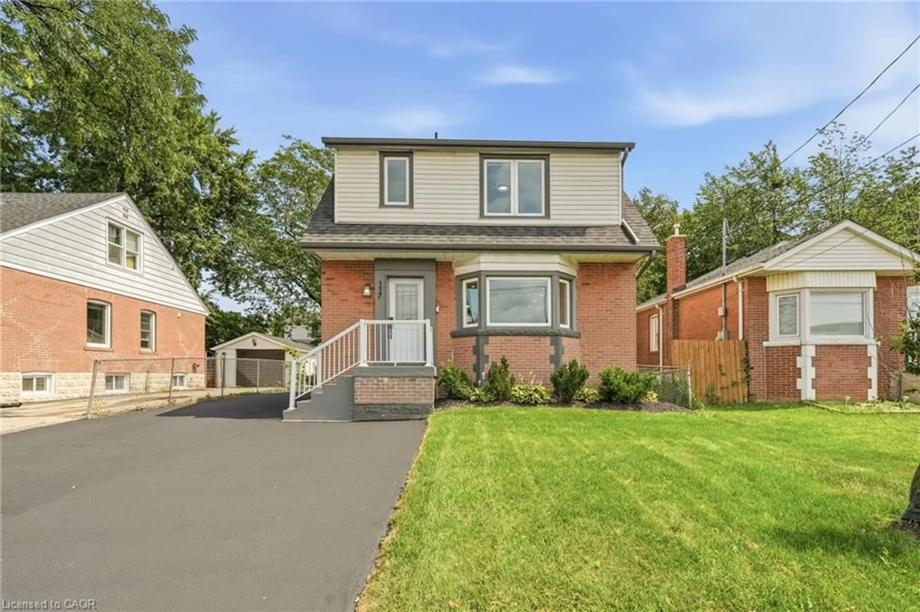 Home with brick exterior material, street for 117 West 5th St, Hamilton Ontario L9C 3N7