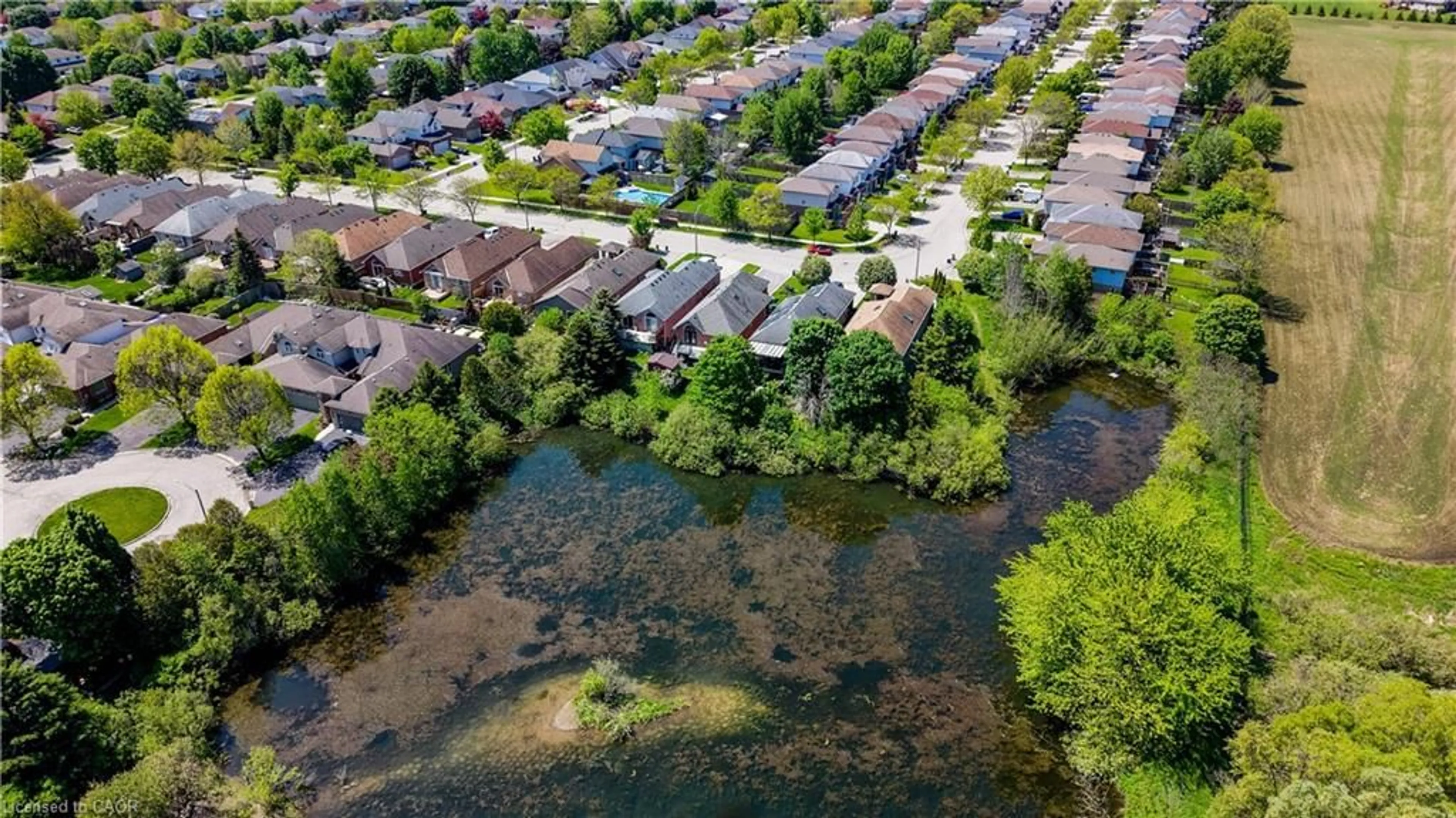 A pic from outside/outdoor area/front of a property/back of a property/a pic from drone, water/lake/river/ocean view for 442 Sandbanks Cres, Waterloo Ontario N2V 2J1