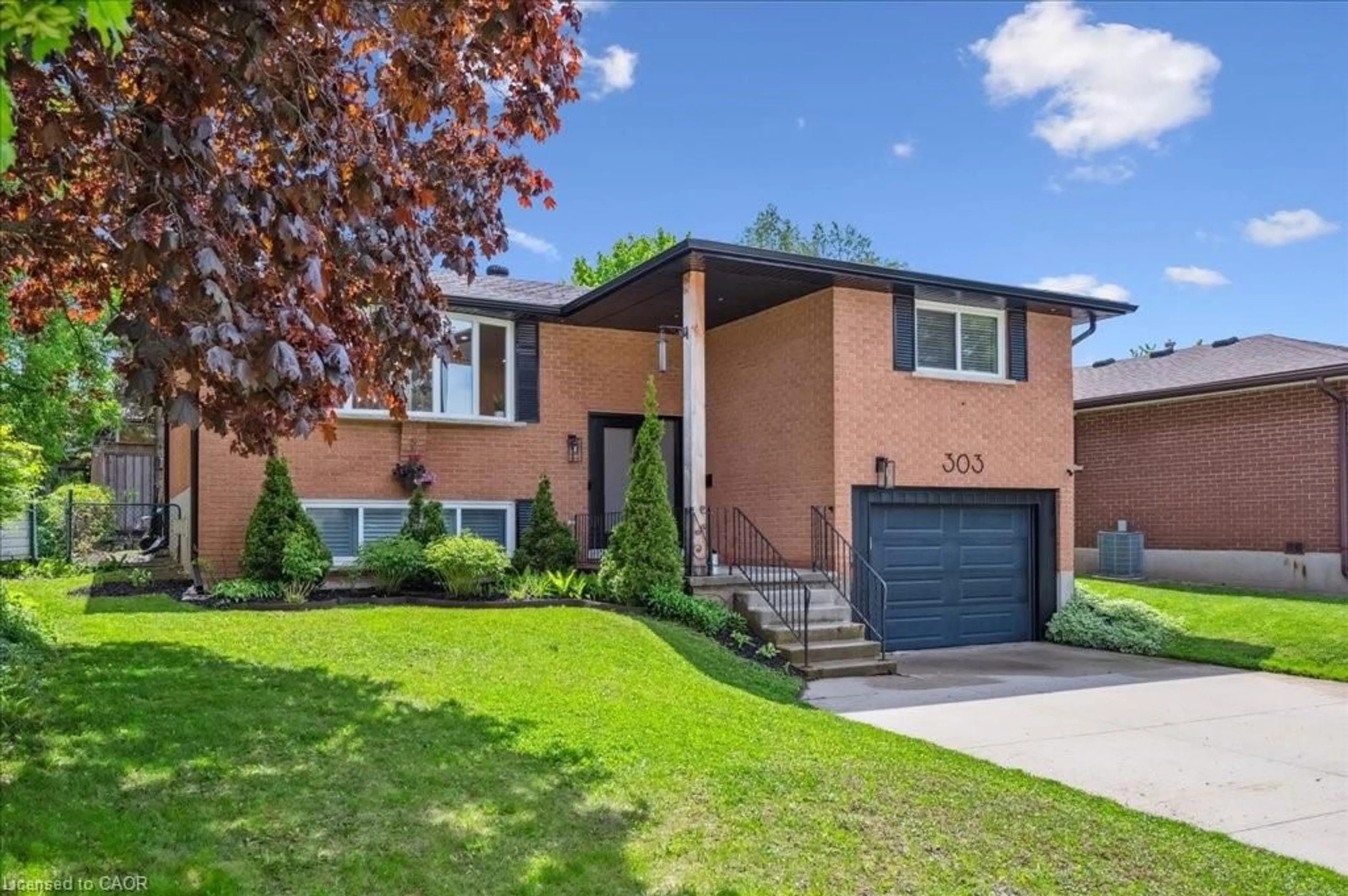 Home with brick exterior material, street for 303 Martindale Cres, Waterloo Ontario N2L 4M8