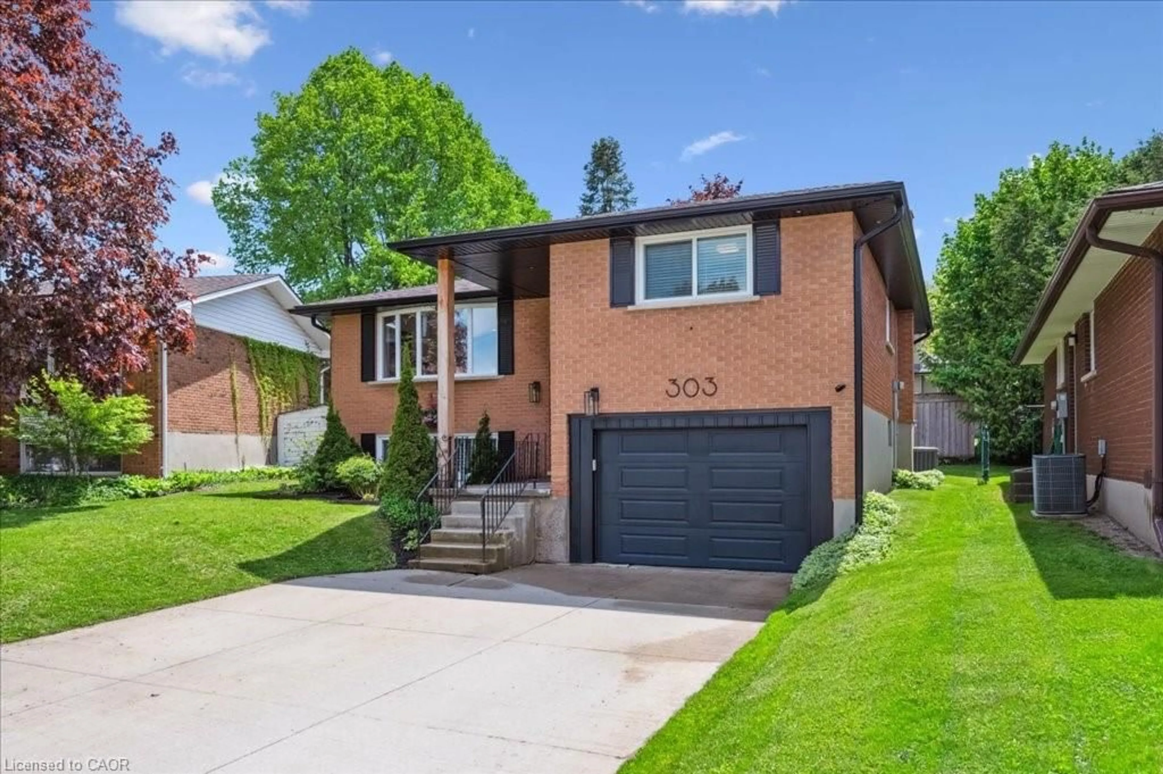 Home with brick exterior material, street for 303 Martindale Cres, Waterloo Ontario N2L 4M8