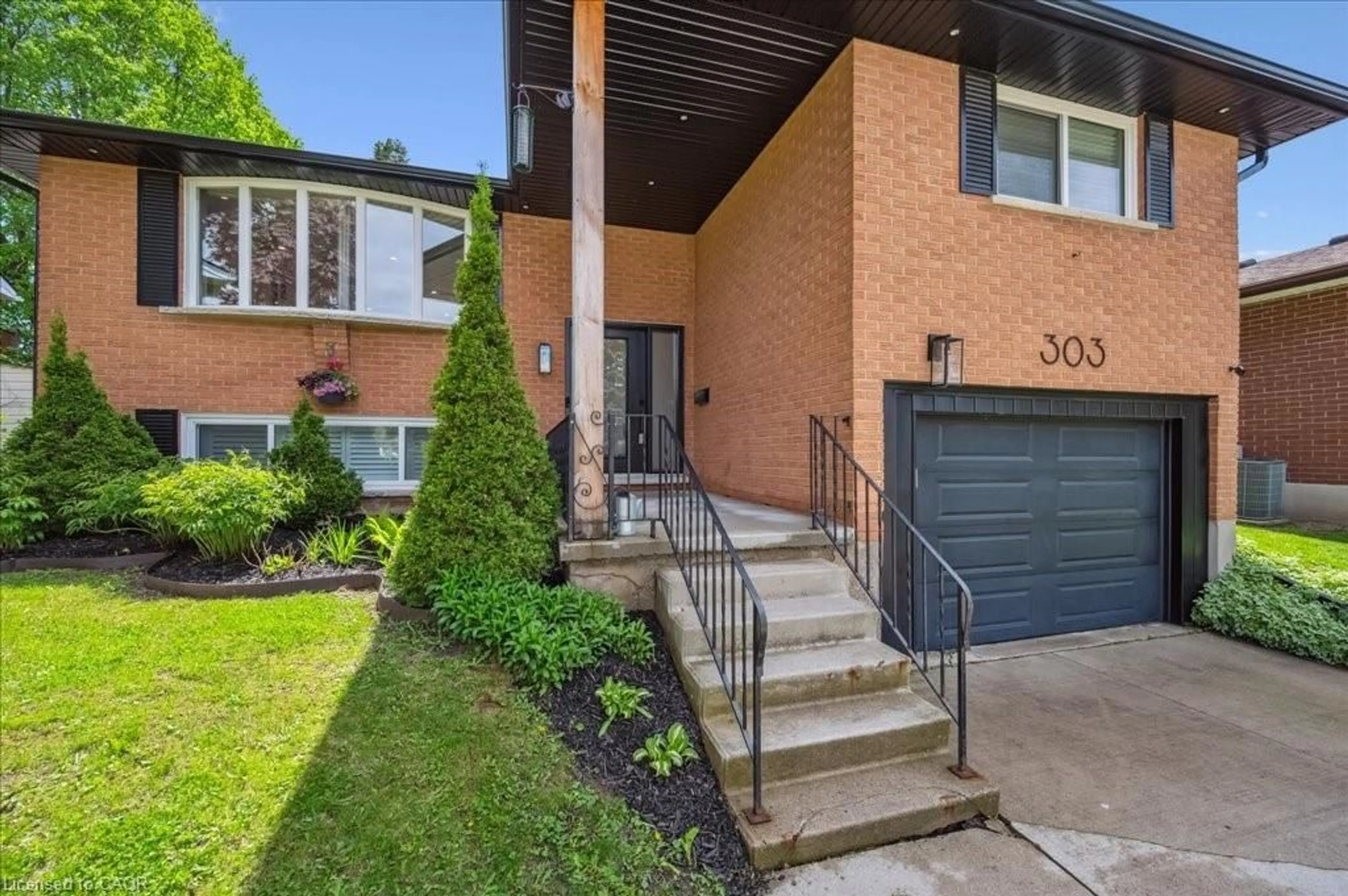 Home with brick exterior material, street for 303 Martindale Cres, Waterloo Ontario N2L 4M8