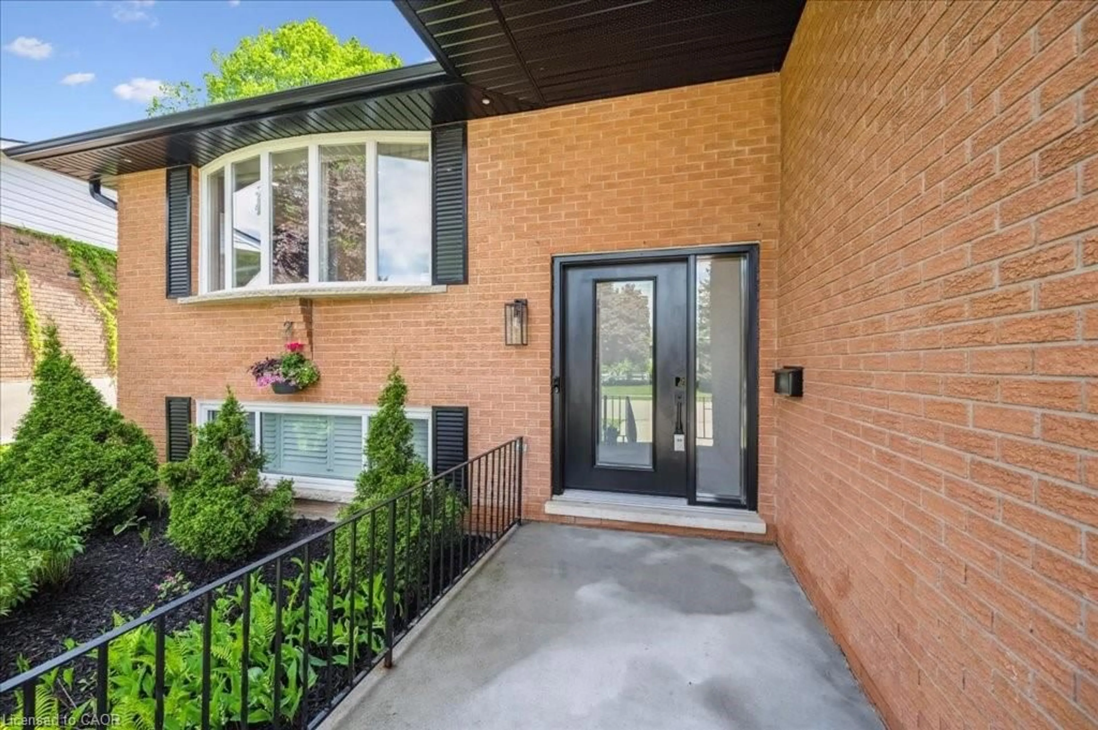 Home with brick exterior material, street for 303 Martindale Cres, Waterloo Ontario N2L 4M8
