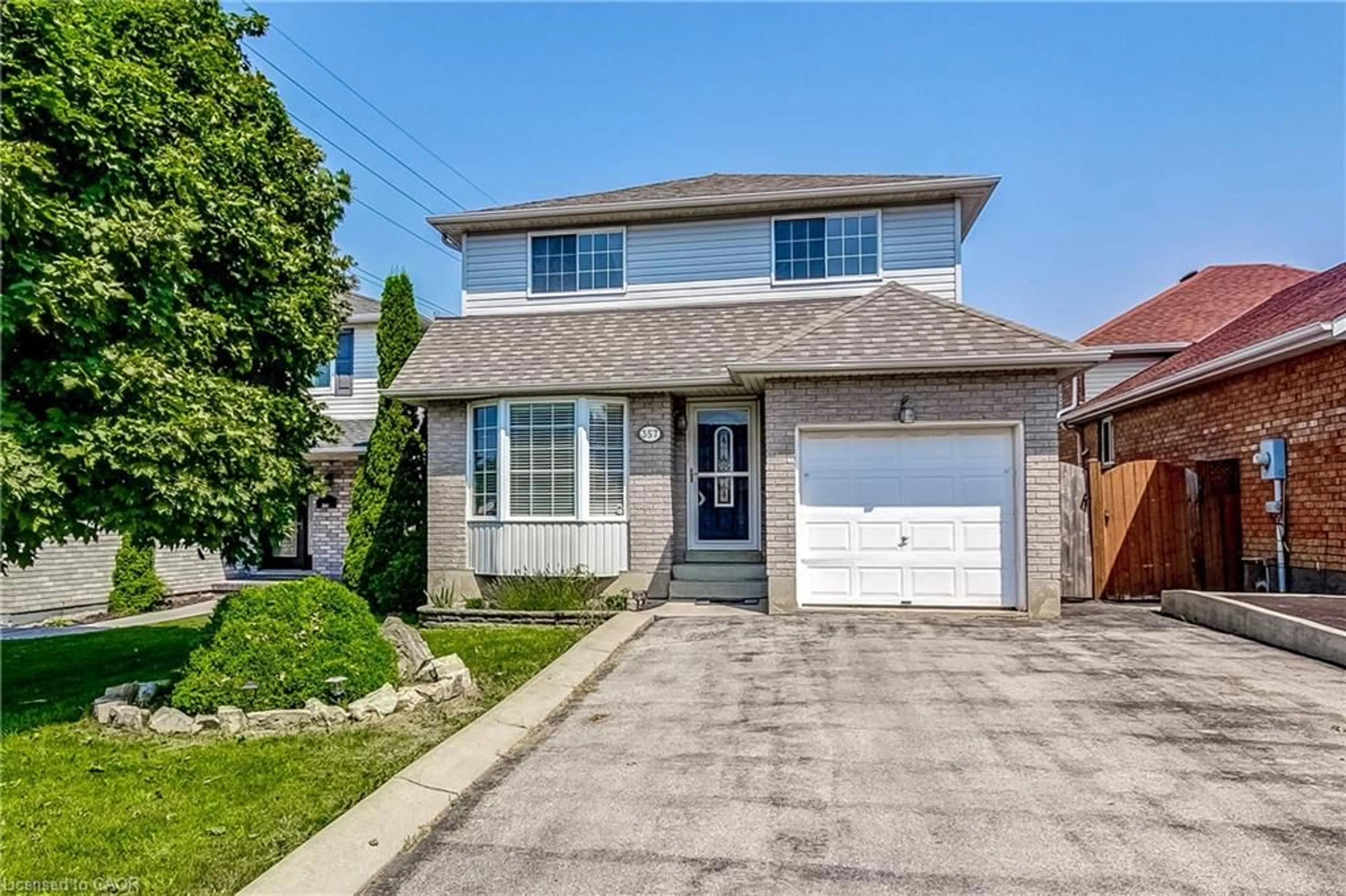 Home with brick exterior material, street for 357 Acadia Dr, Hamilton Ontario L8W 3L7