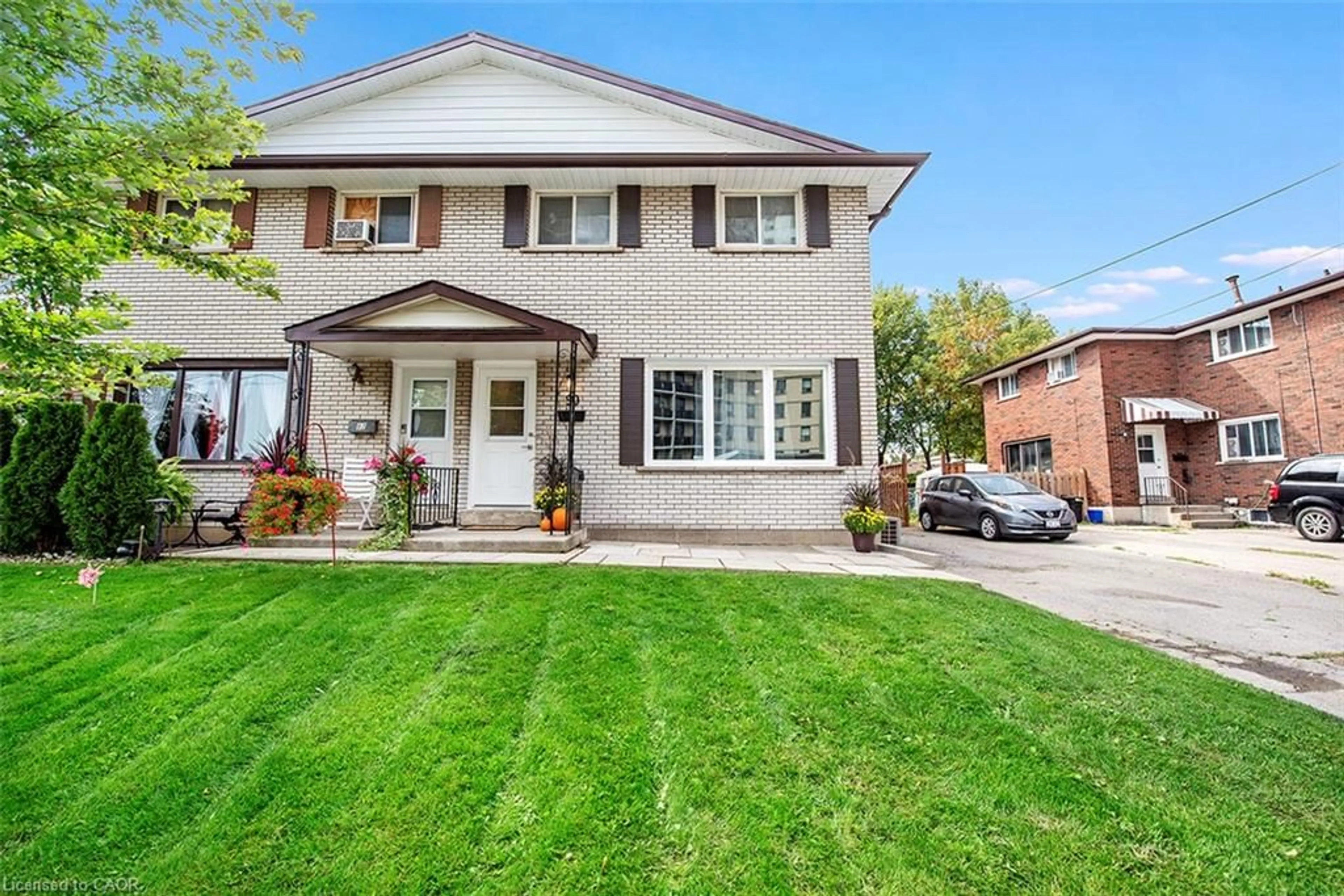 Home with brick exterior material, street for 88 & 90 Delawana Dr, Hamilton Ontario L8E 1G4