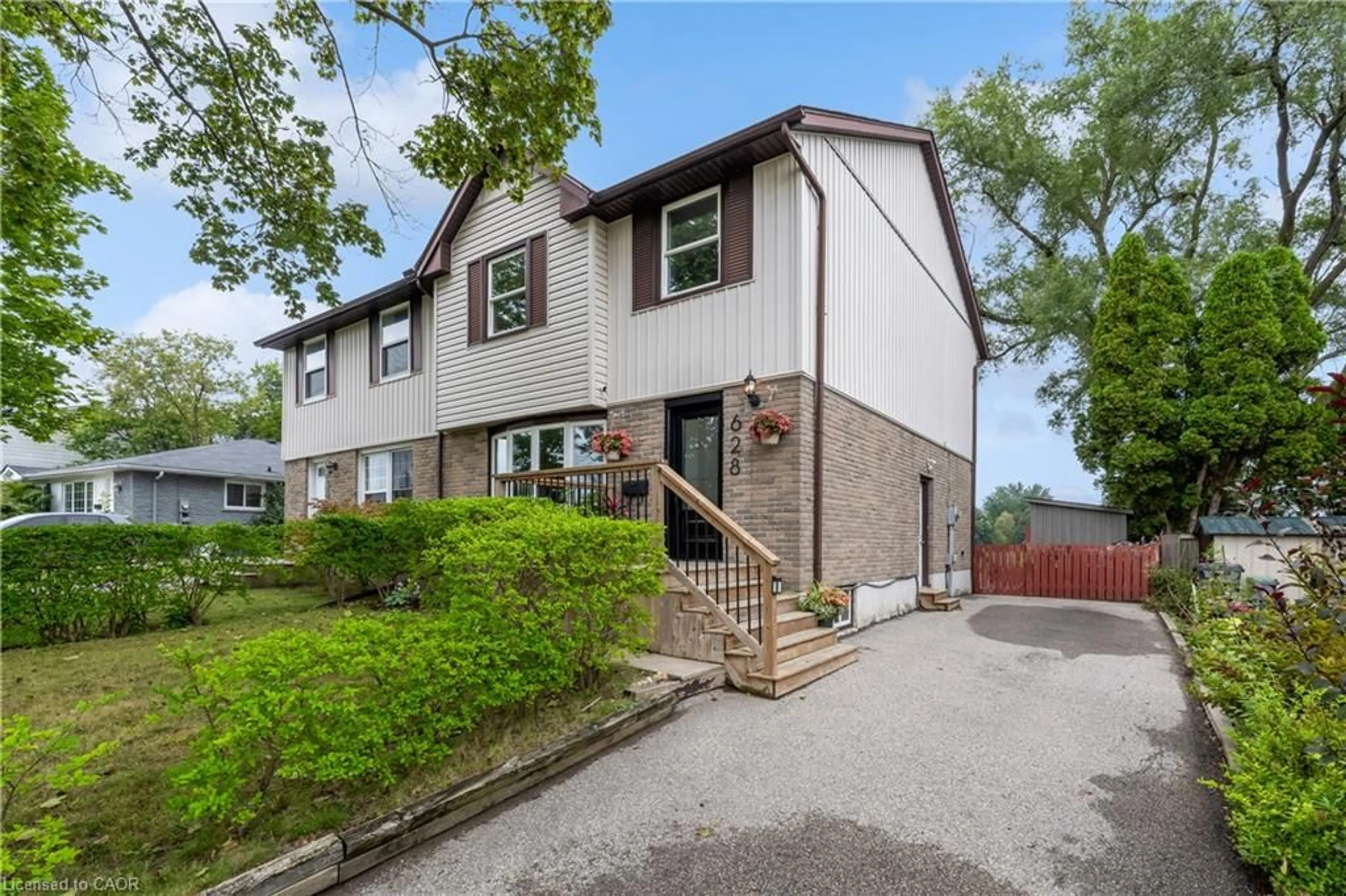 Home with vinyl exterior material, street for 628 College Ave, Guelph Ontario N1G 1T8