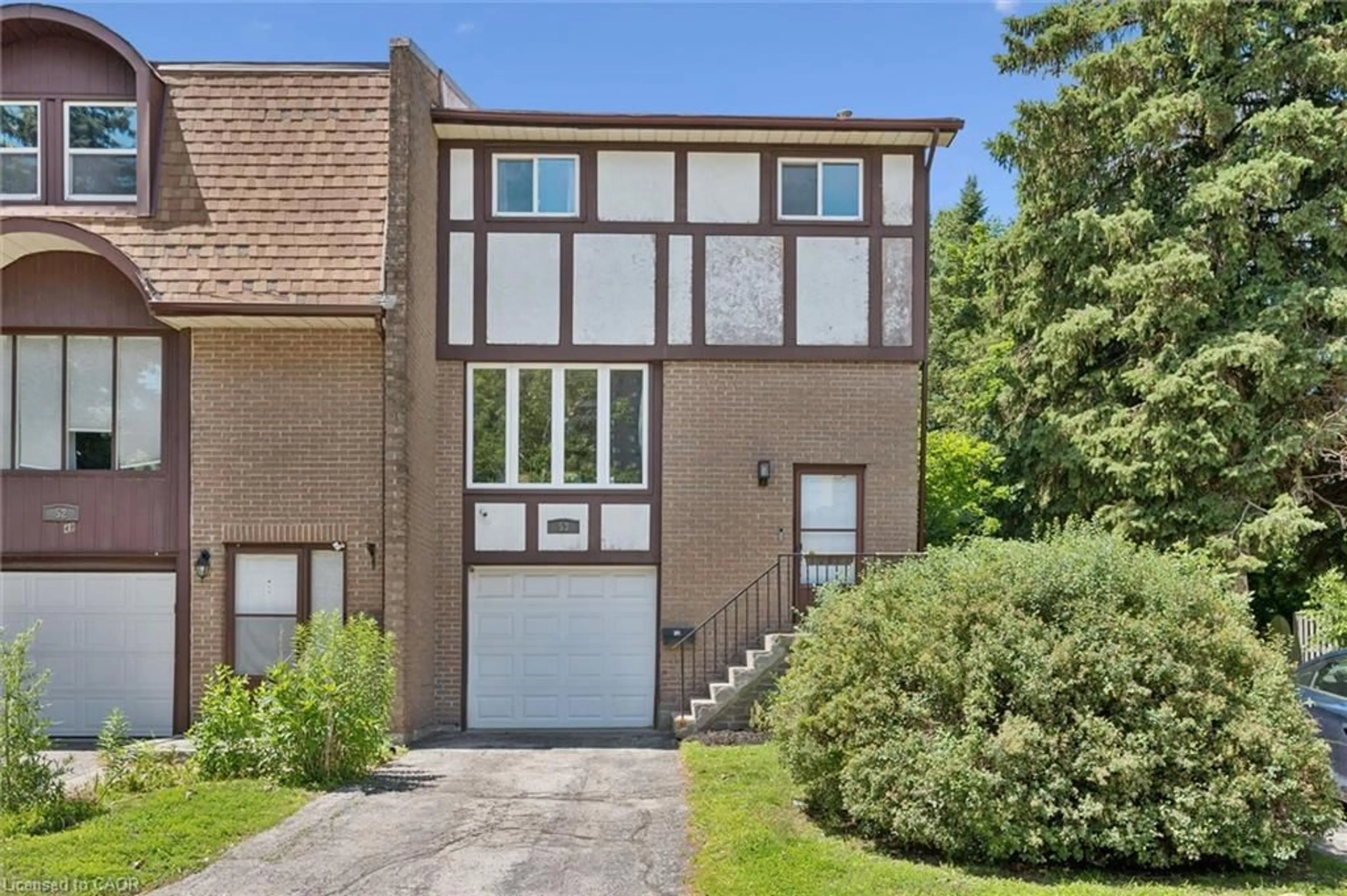 Home with brick exterior material, street for 49 Cedarwoods Cres #53, Kitchener Ontario N2C 2L1