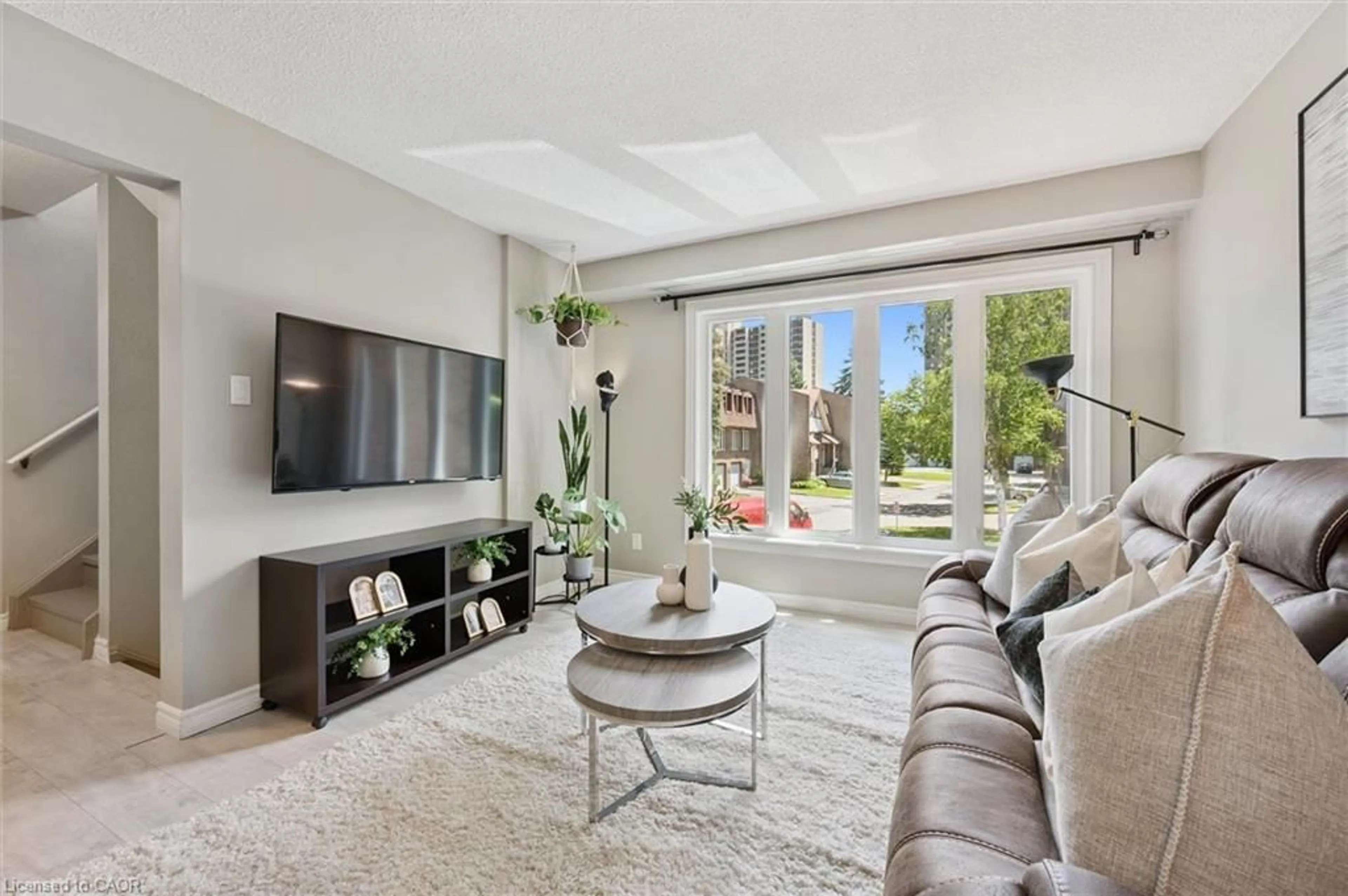 Living room with furniture, unknown for 49 Cedarwoods Cres #53, Kitchener Ontario N2C 2L1