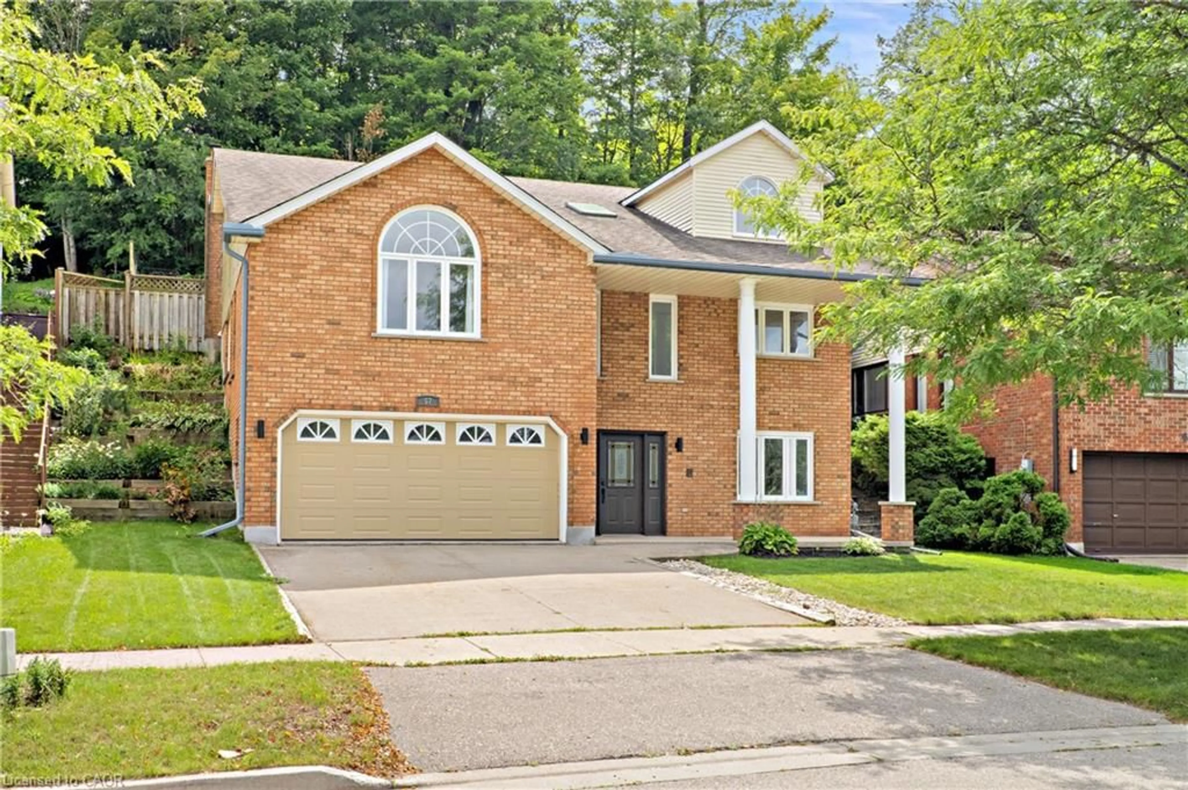 Home with brick exterior material, street for 57 Yellow Birch Dr, Kitchener Ontario N2N 2M3