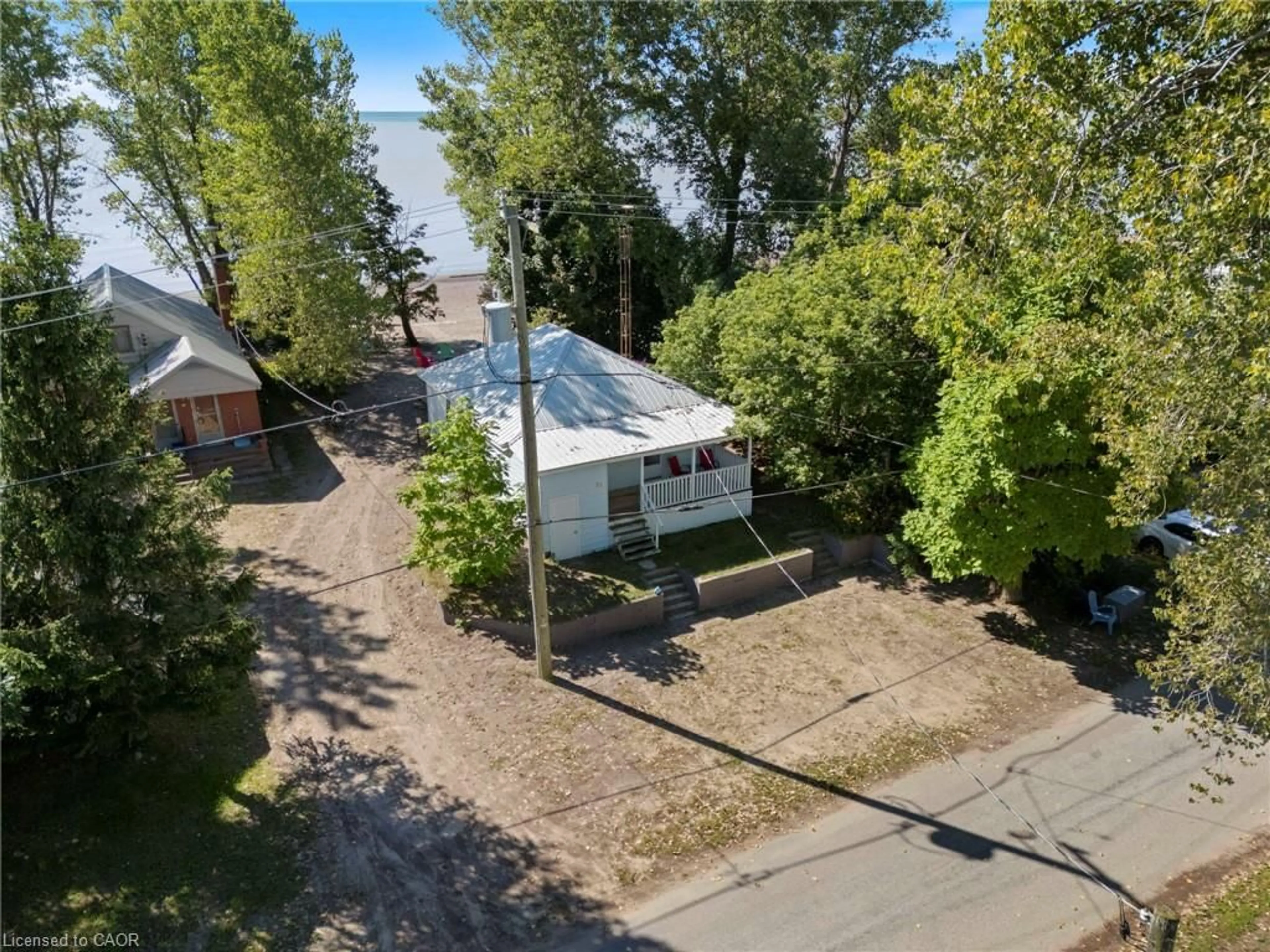 A pic from outside/outdoor area/front of a property/back of a property/a pic from drone, street for 37 Woodstock Ave, Long Point Ontario N0E 1M0