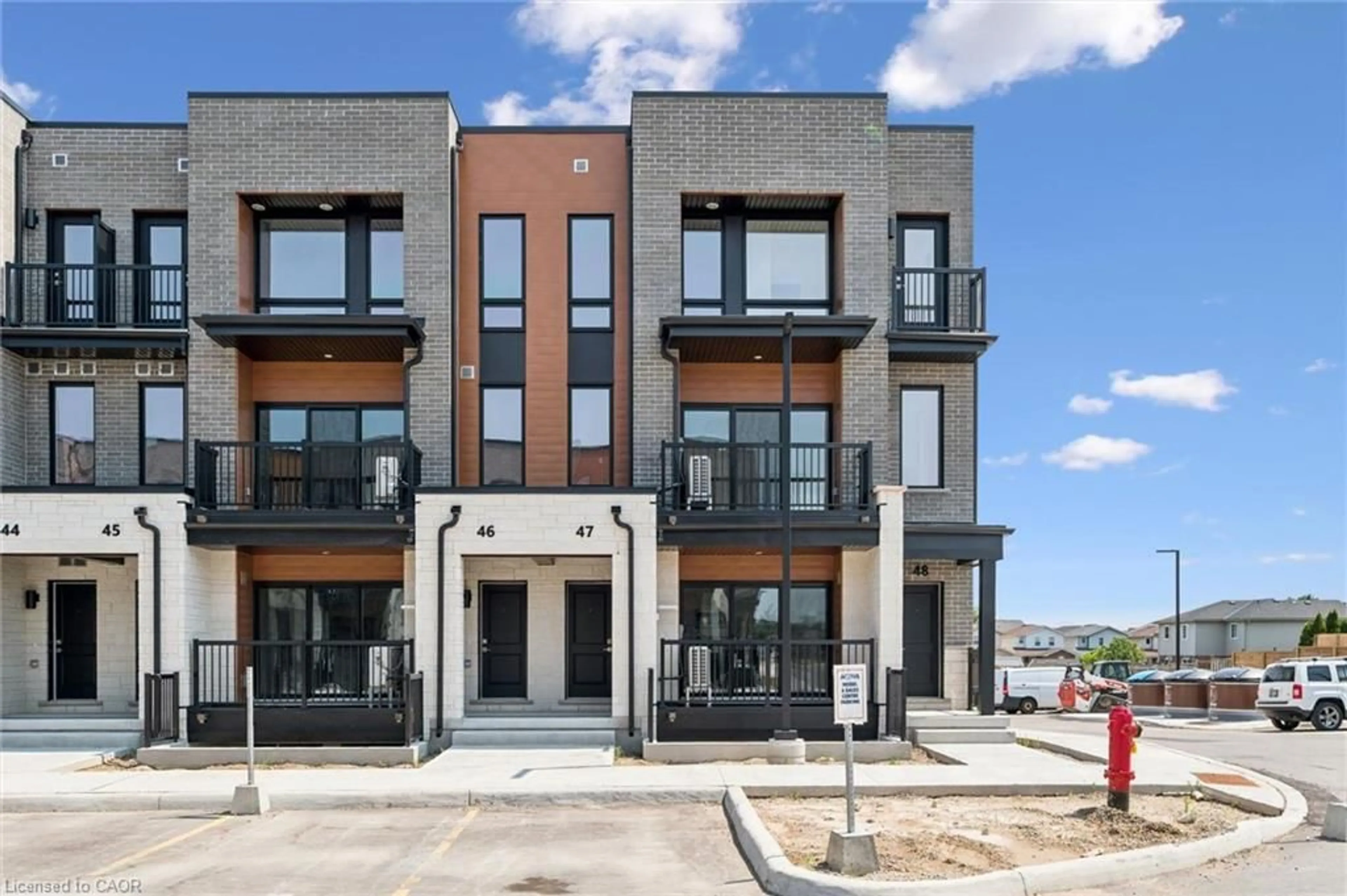 Home with brick exterior material, street for 525 Erinbrook Dr #B047, Kitchener Ontario N2E 0L4