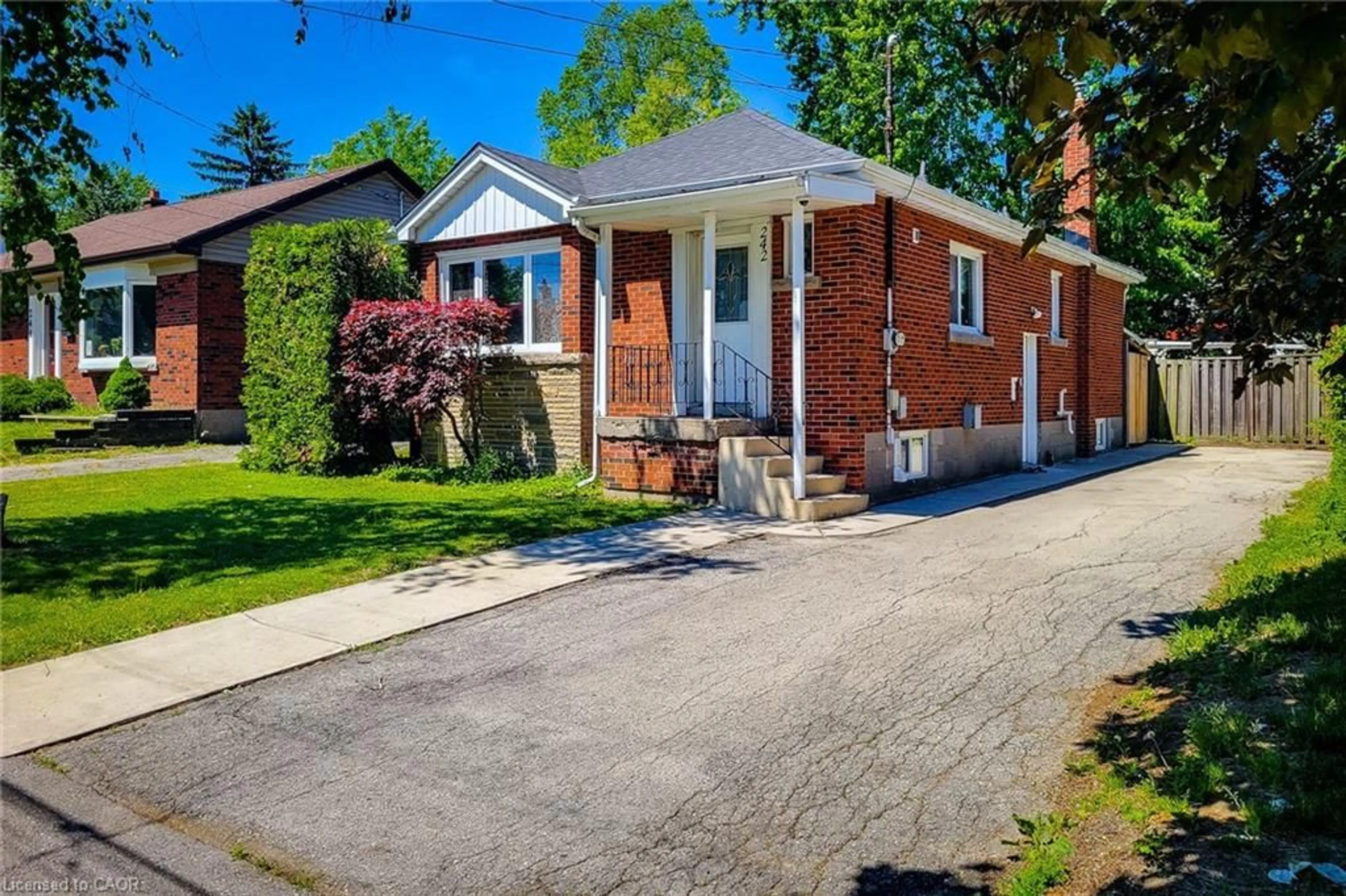 Home with brick exterior material, street for 242 West 2nd St, Hamilton Ontario L9C 3G5