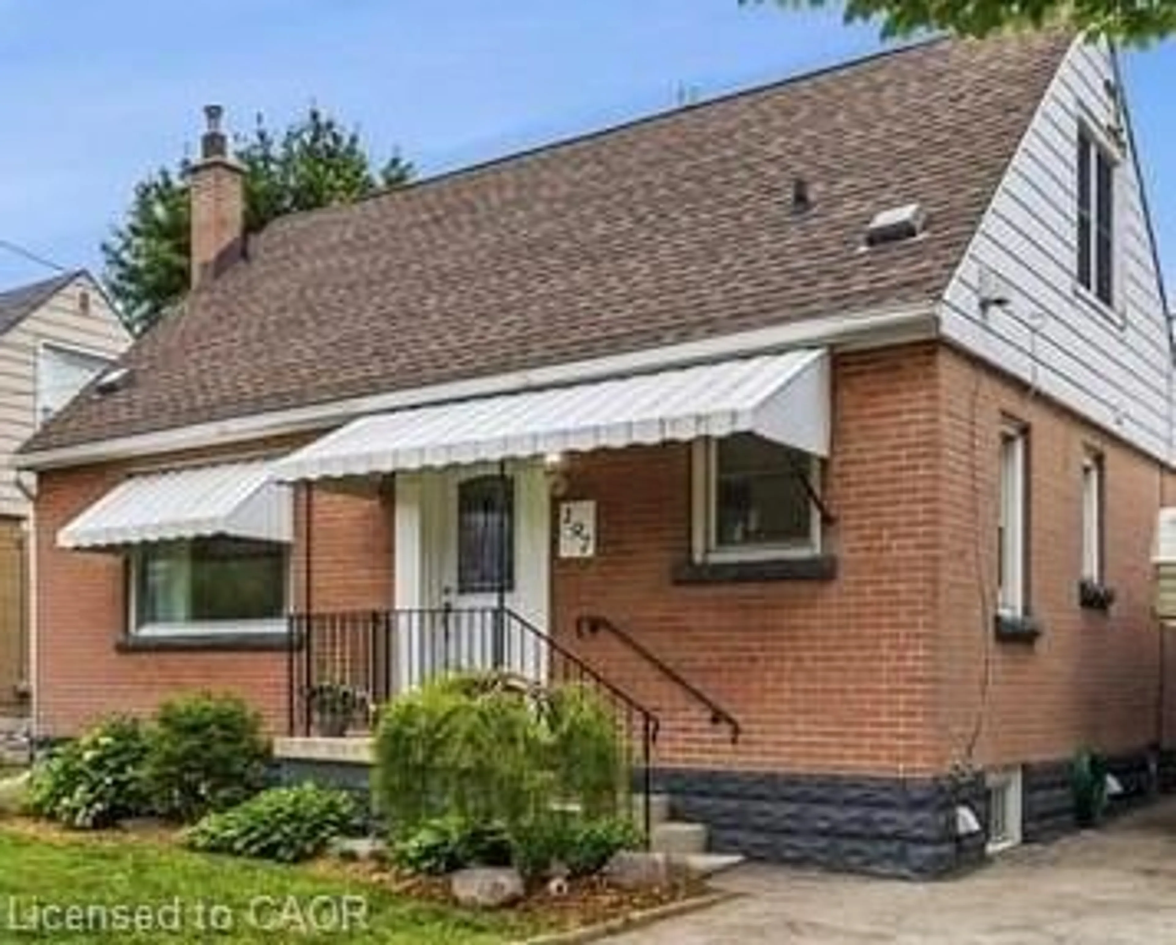 Home with brick exterior material, street for 197 East 12th St, Hamilton Ontario L9A 3X5
