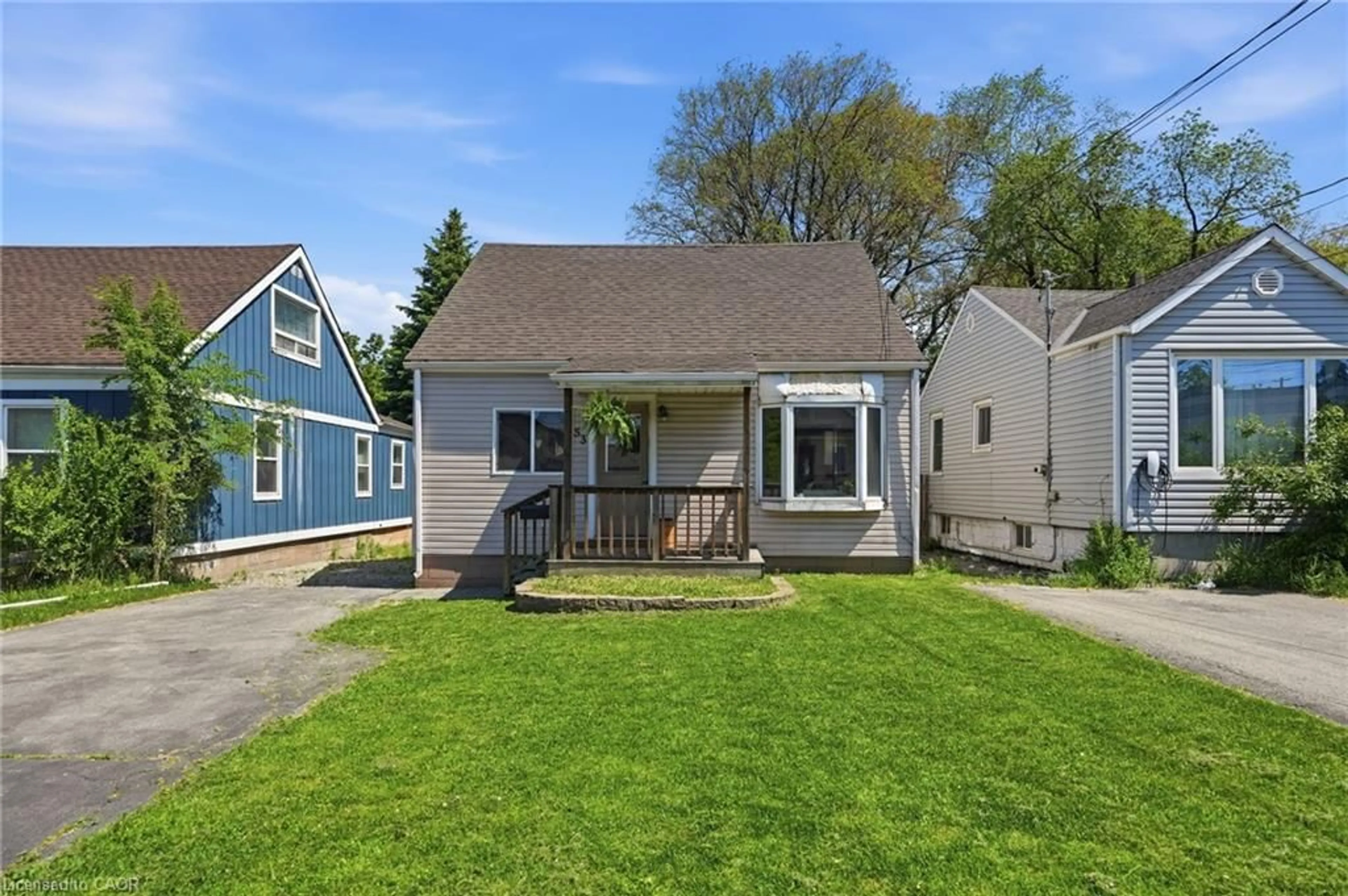 Home with vinyl exterior material, street for 53 Dalhousie Ave, Hamilton Ontario L8L 3J4