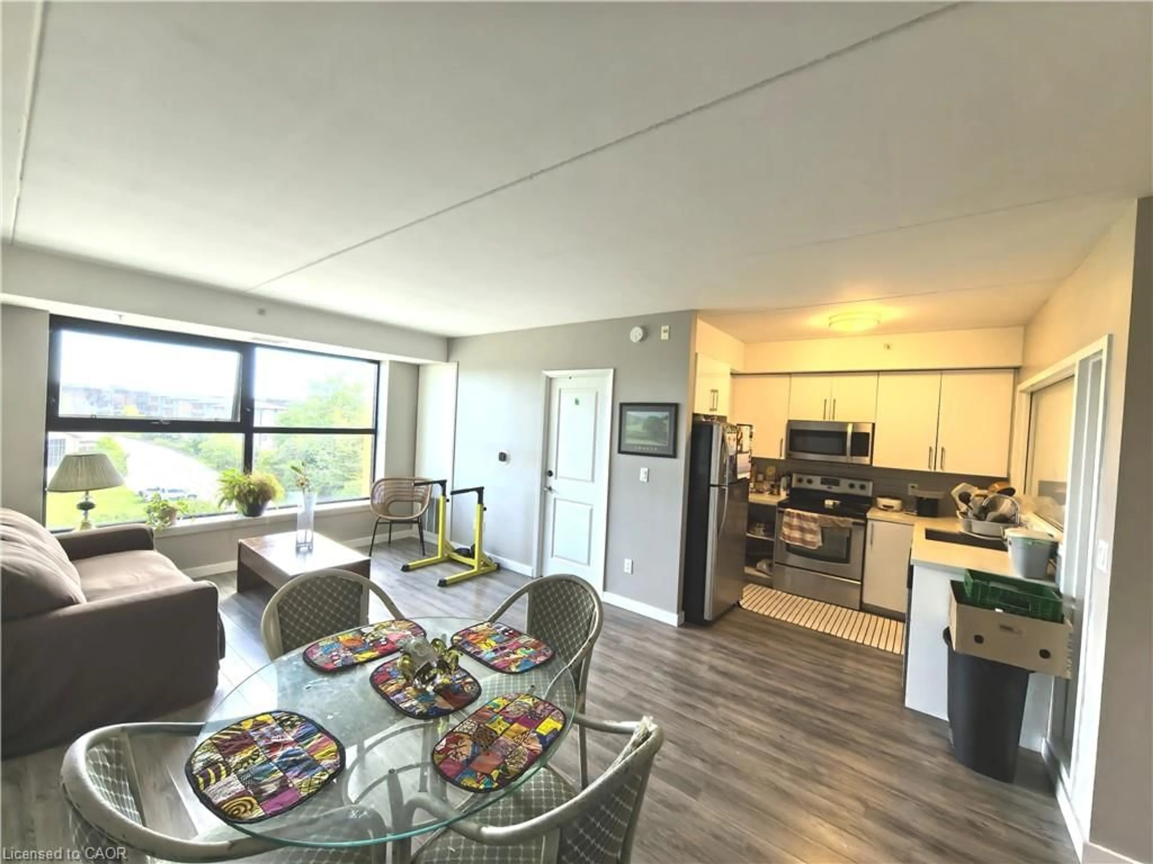Open concept kitchen, wood/laminate floor for 1291 Gordon St #506, Guelph Ontario N1L 0M5