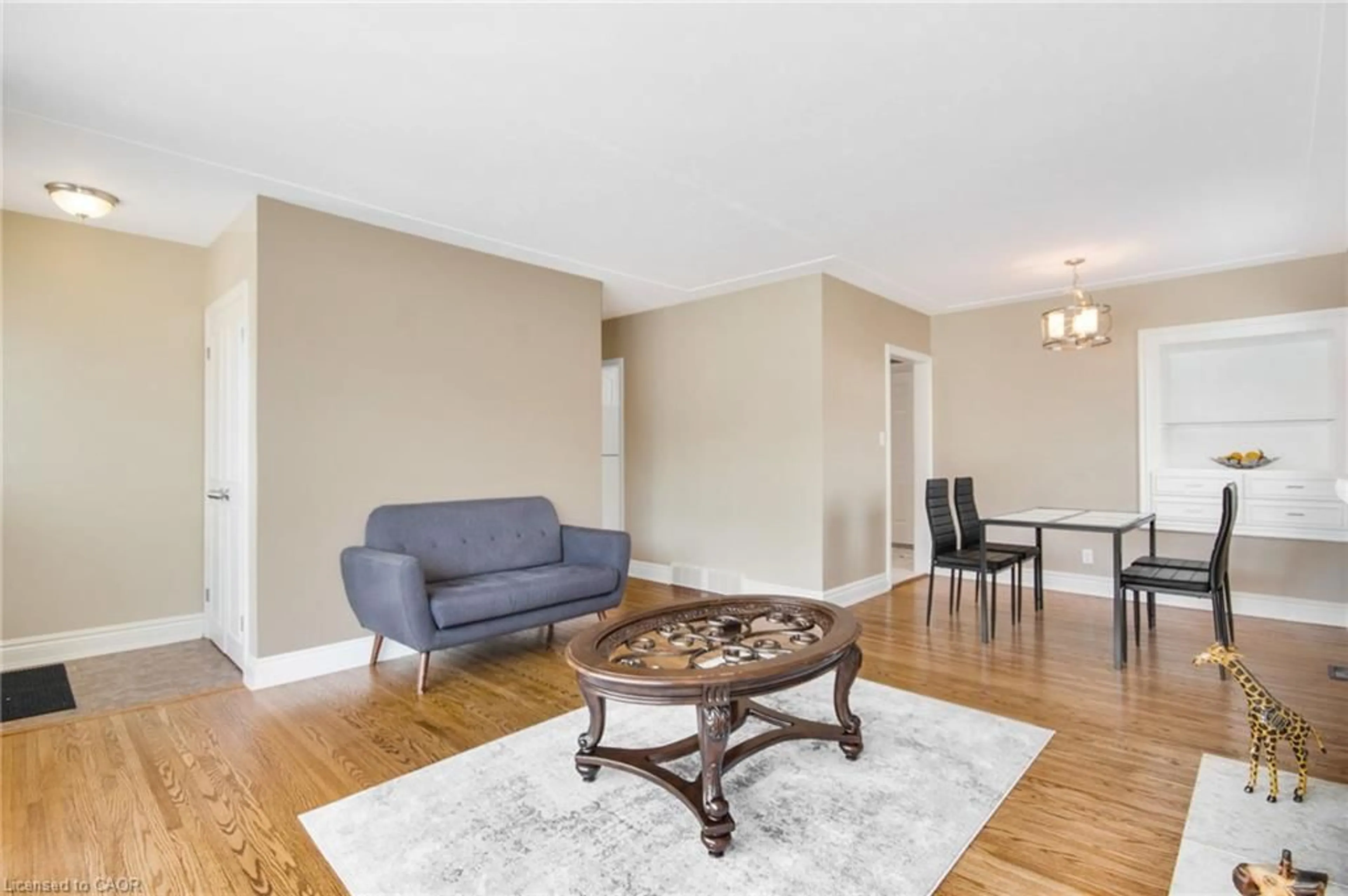 Living room with furniture, wood/laminate floor for 185 Burlington St, London Ontario N5Z 3V9
