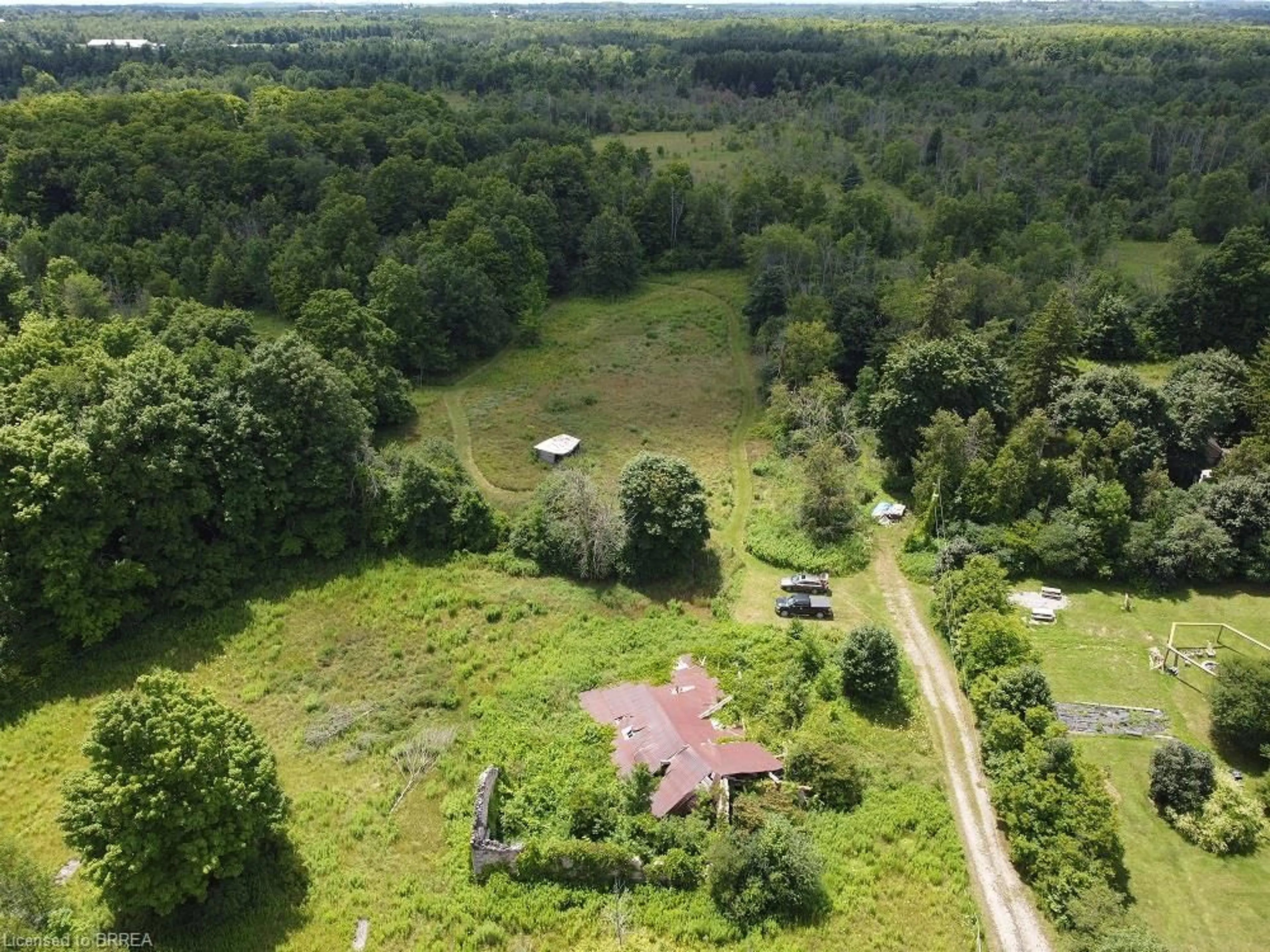 A pic from outside/outdoor area/front of a property/back of a property/a pic from drone, forest/trees view for 9414 First Line Nassagaweya, Milton Ontario L0P 1J0