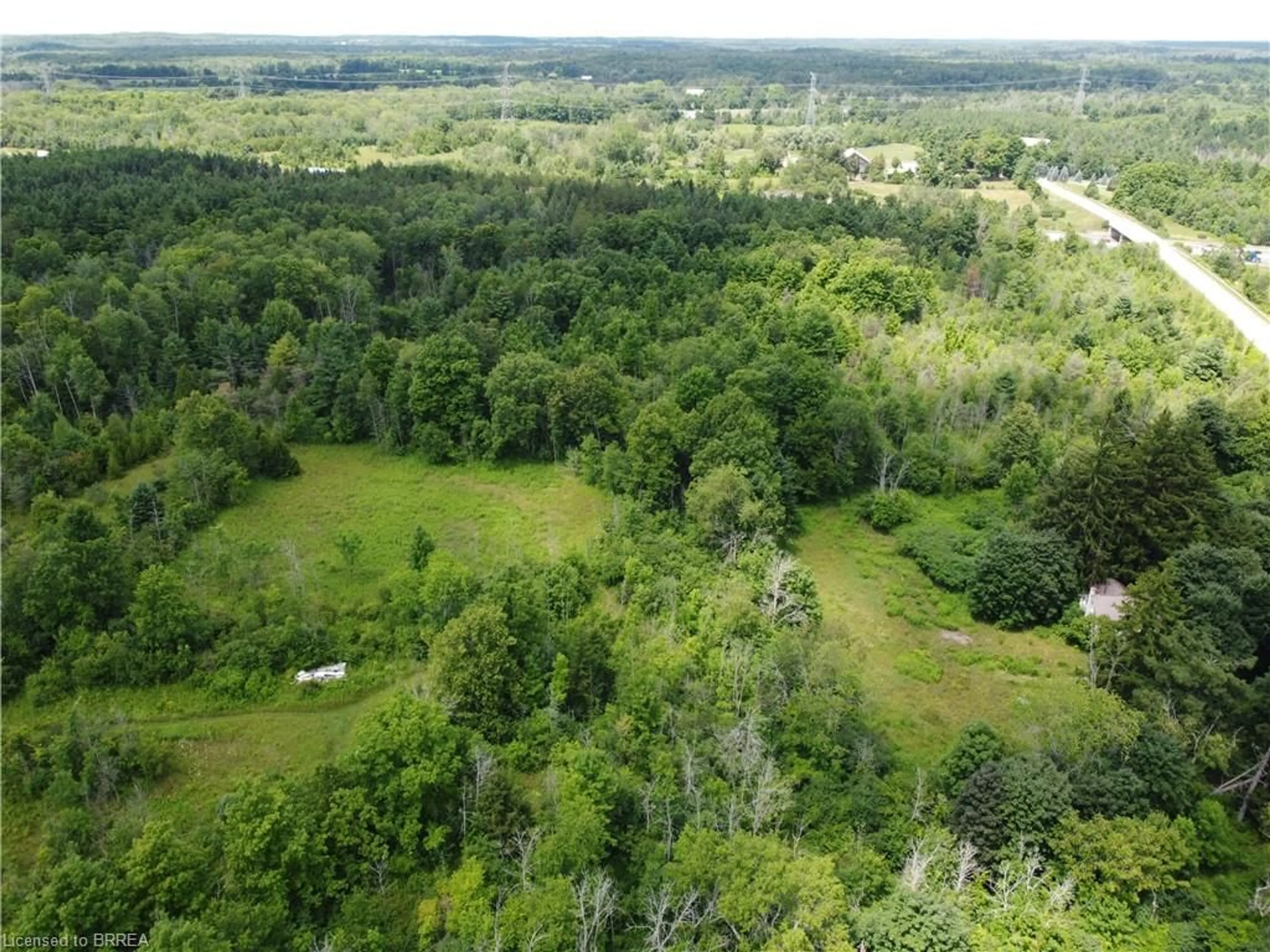 A pic from outside/outdoor area/front of a property/back of a property/a pic from drone, forest/trees view for 9414 First Line Nassagaweya, Milton Ontario L0P 1J0