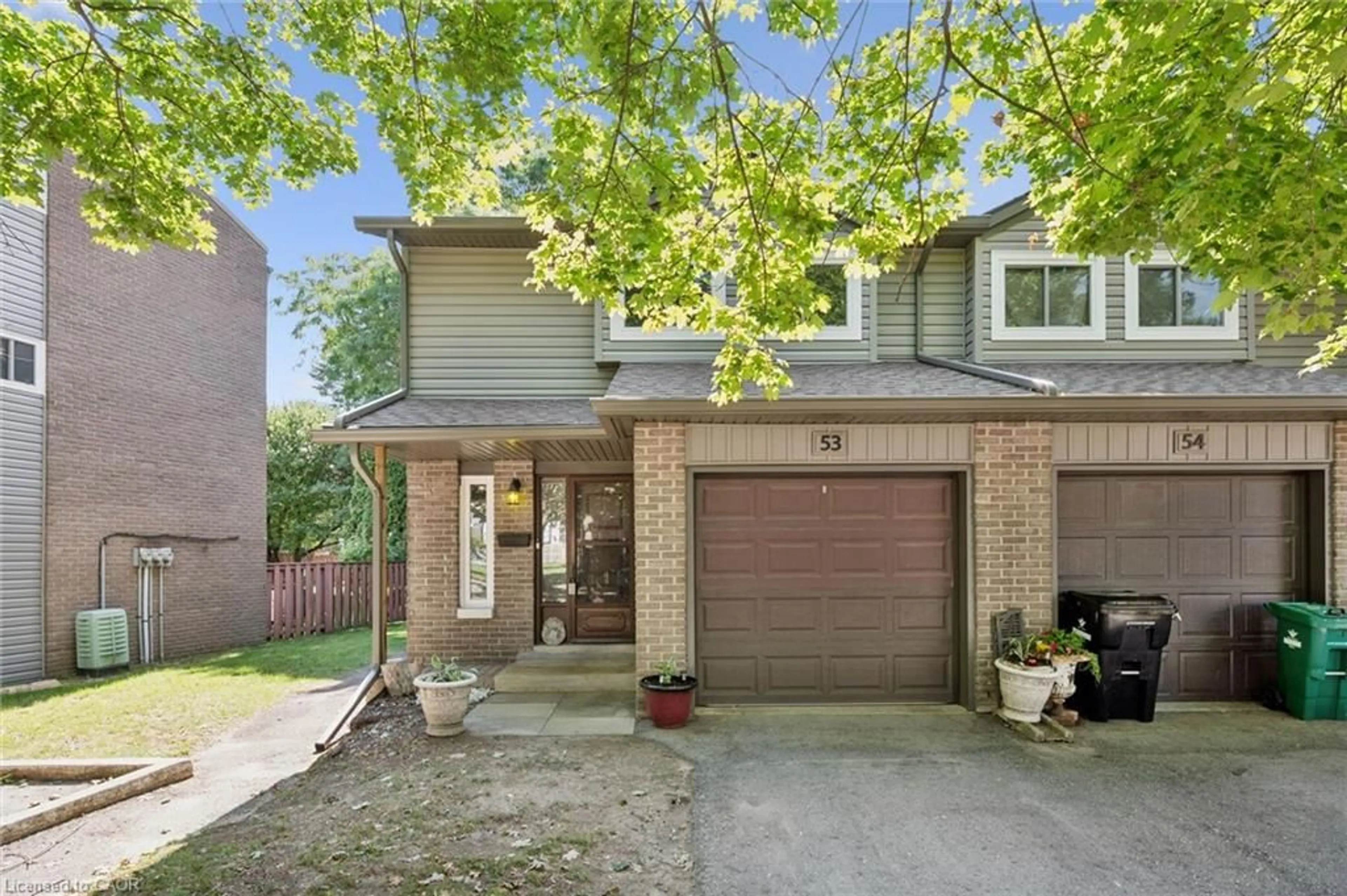 Home with brick exterior material, street for 46 Cedarwoods Cres #53, Kitchener Ontario N2C 2L7