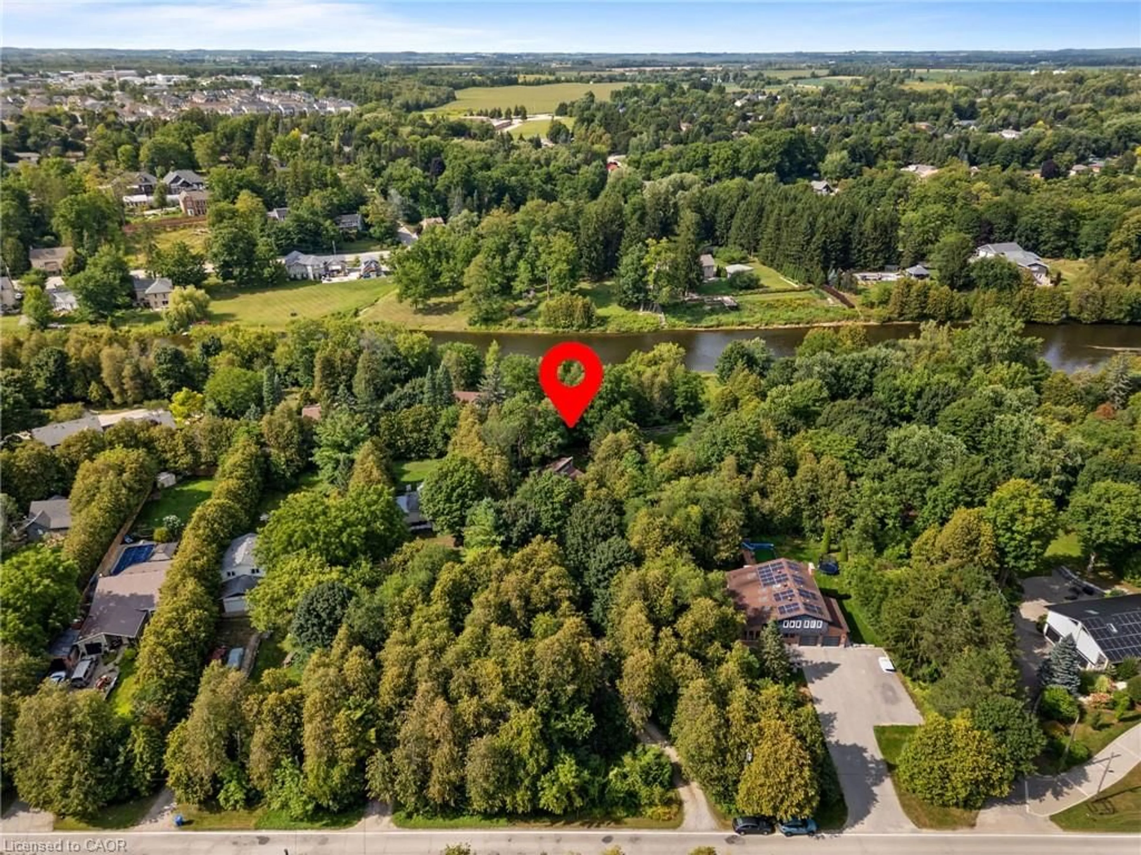 A pic from outside/outdoor area/front of a property/back of a property/a pic from drone, forest/trees view for 581 Orangeville Rd, Centre Wellington Ontario N1M 1T9