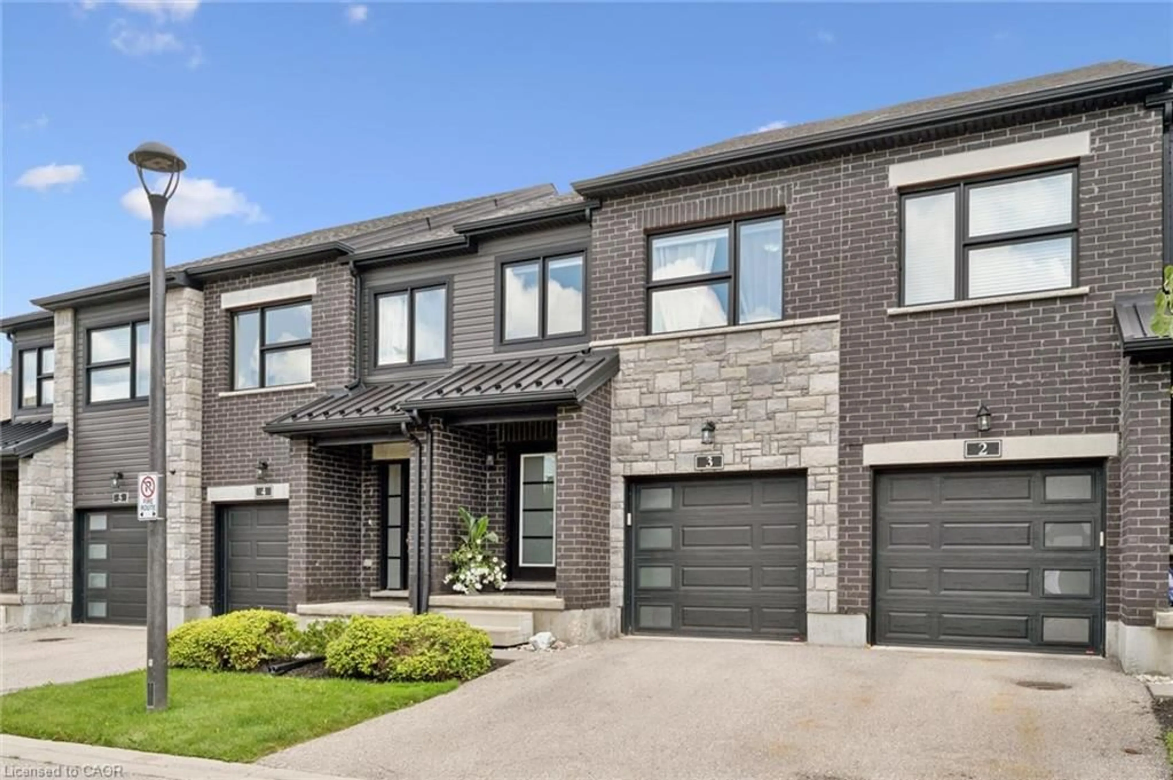 Home with brick exterior material, street for 91 Poppy Dr #3, Guelph Ontario N1L 0M6