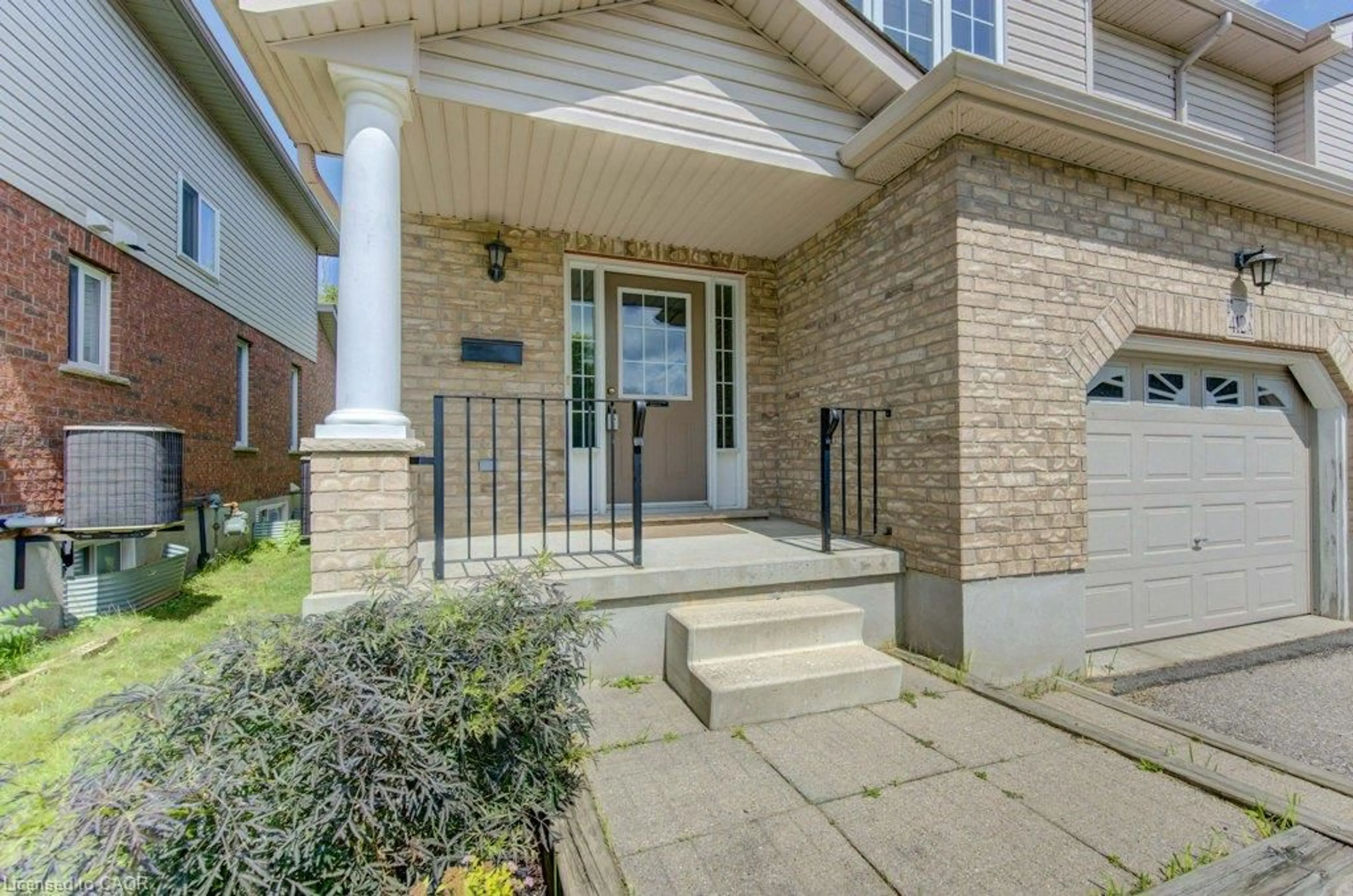 Home with brick exterior material, street for 412 Tealby Cres #A, Waterloo Ontario N2J 4Y8