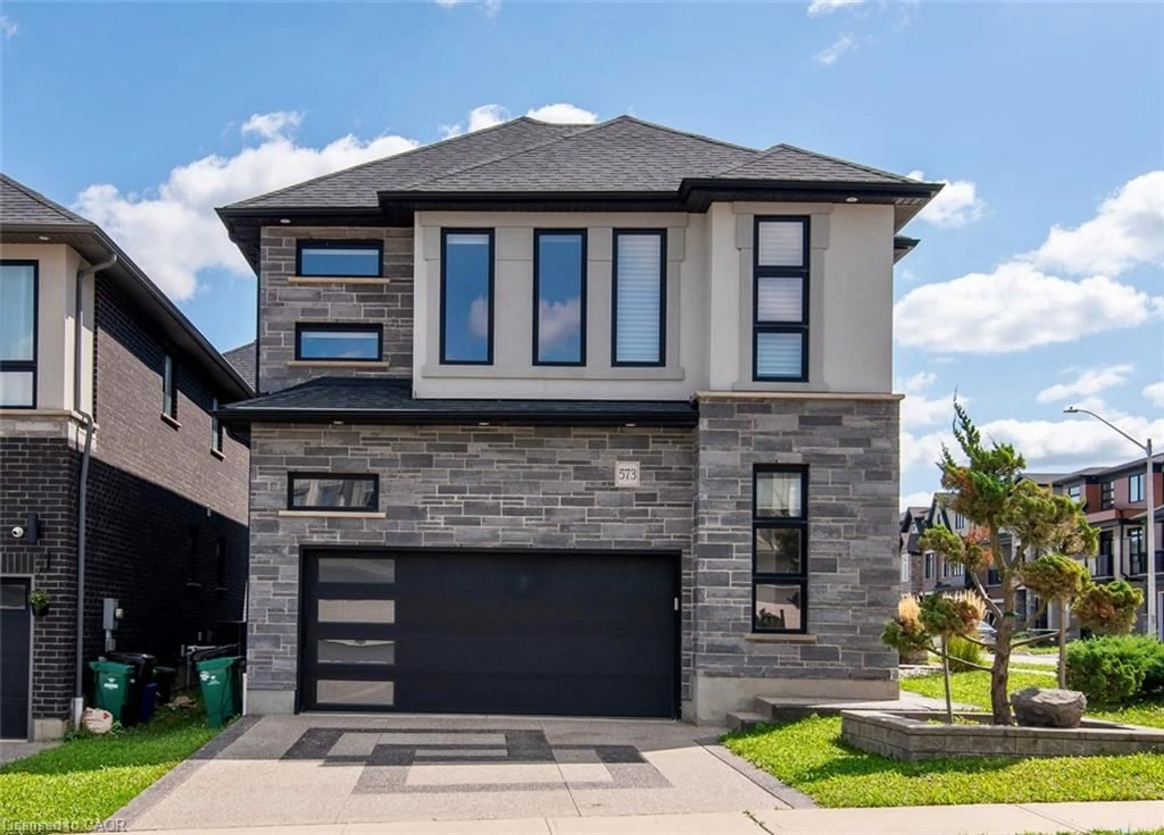 Home with brick exterior material, street for 573 Mayapple St, Waterloo Ontario N2V 0G2