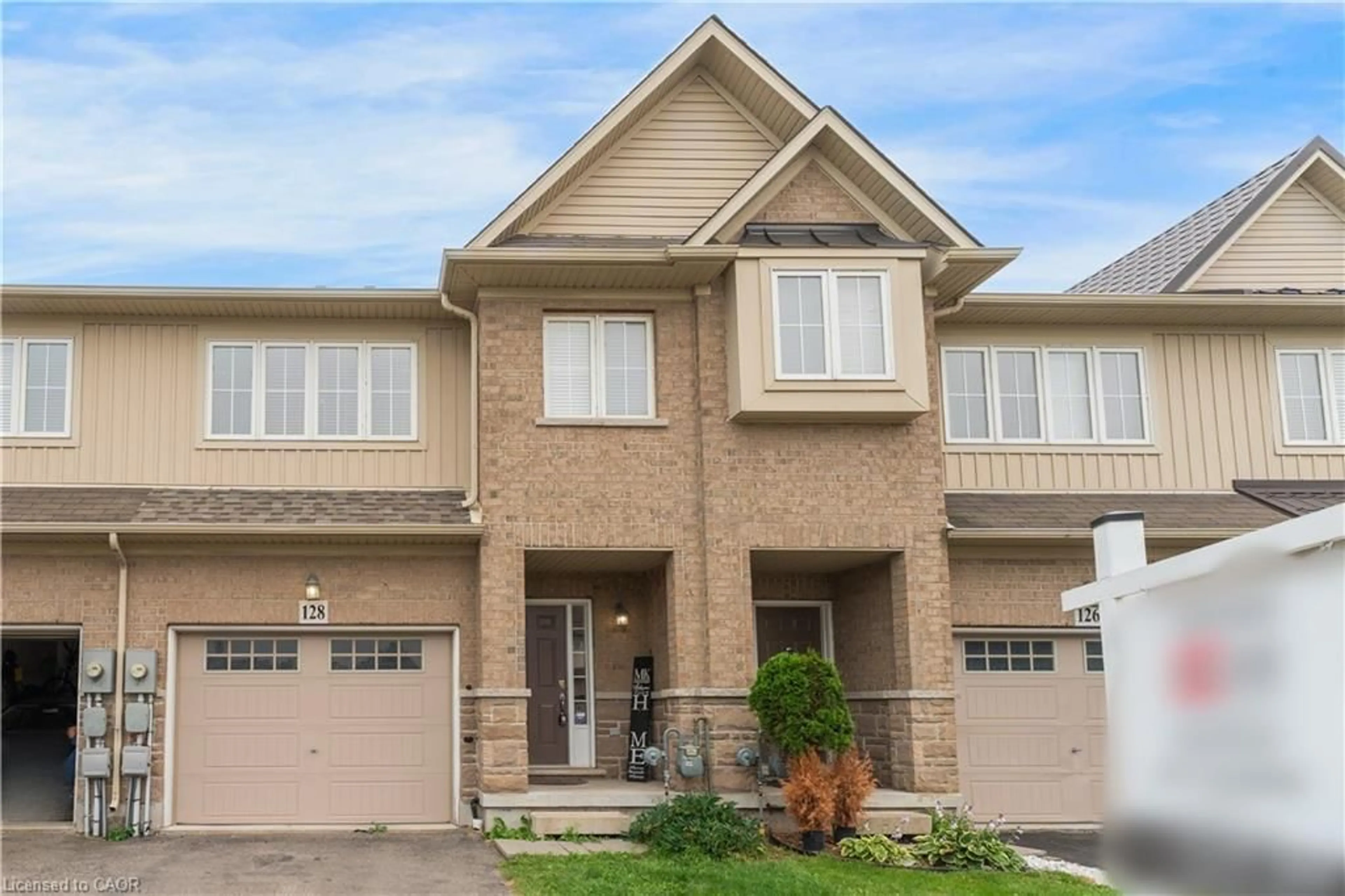 Home with brick exterior material, street for 128 Palacebeach Trail, Stoney Creek Ontario L8E 0C3