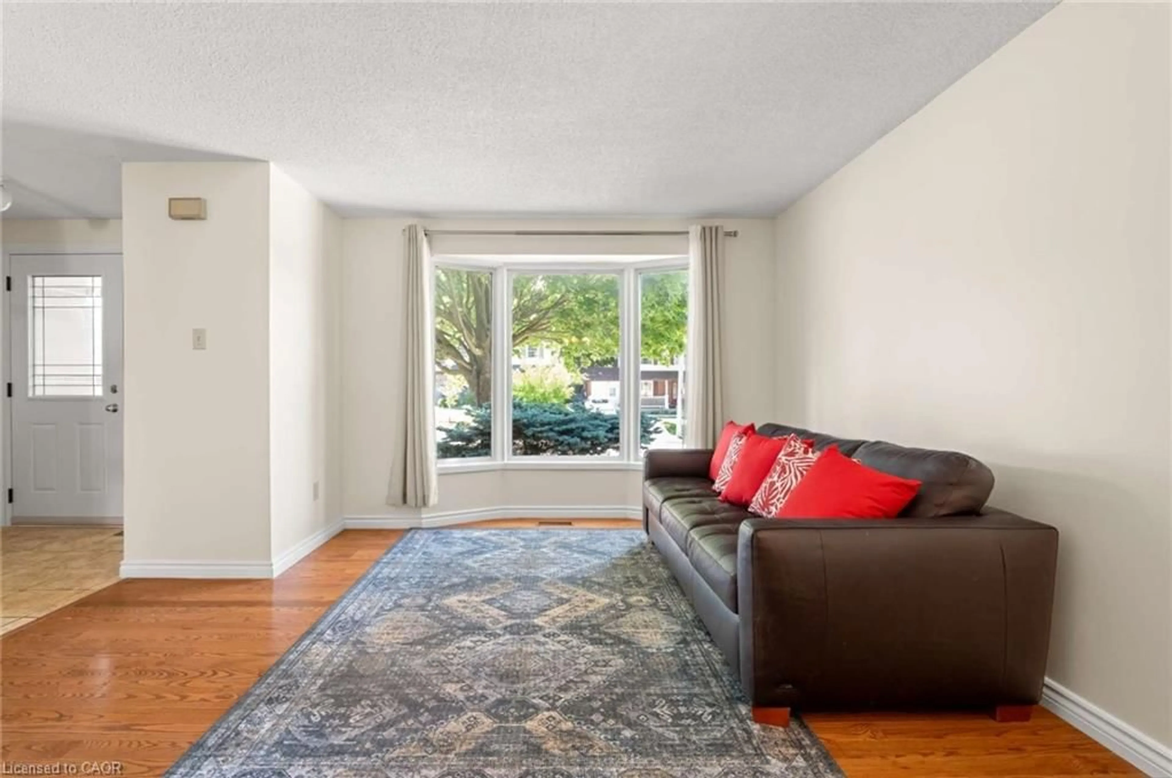 Living room with furniture, carpet floor for 121 Imperial Rd, Guelph Ontario N1H 7Z5
