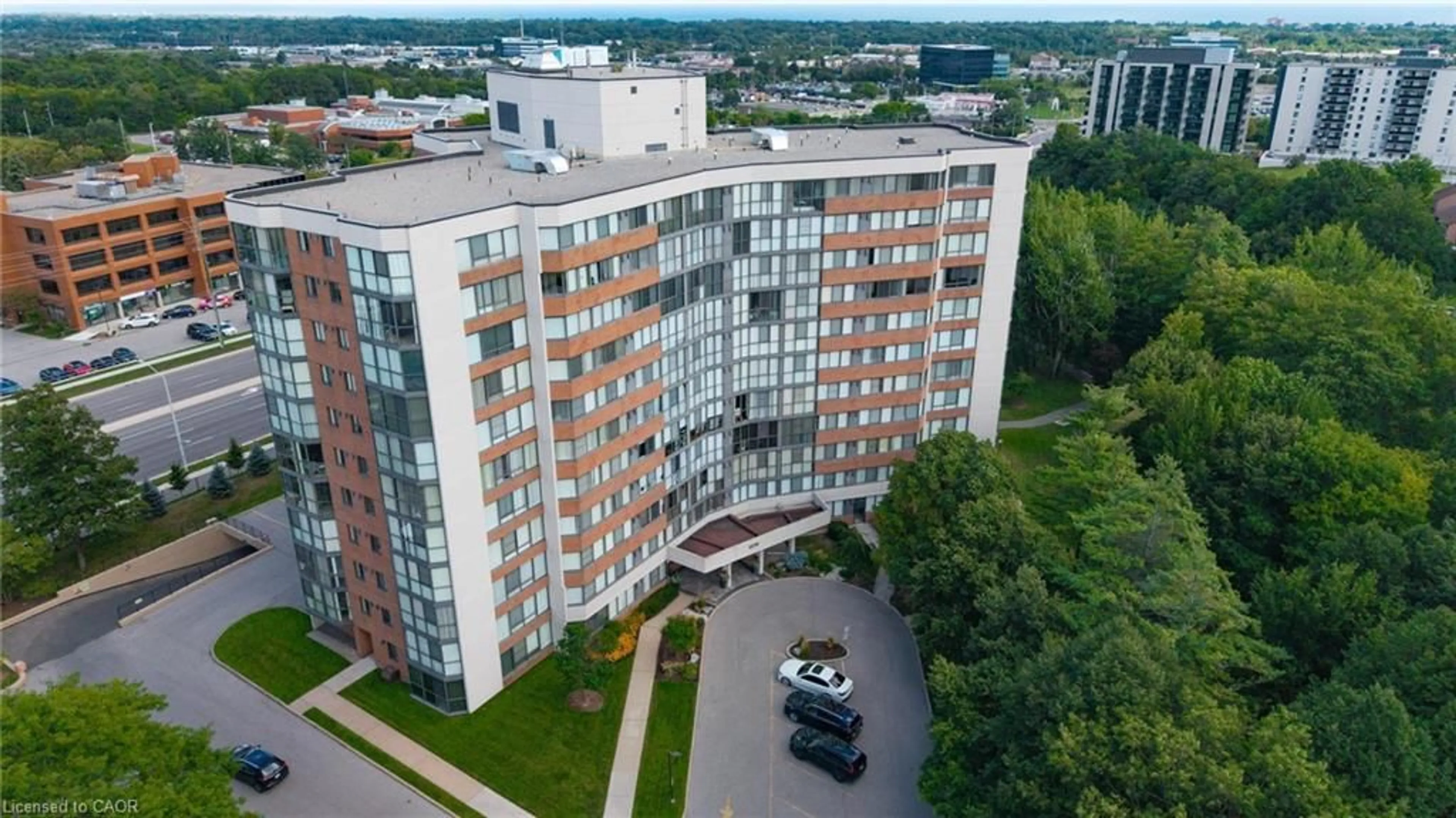A pic from outside/outdoor area/front of a property/back of a property/a pic from drone, city buildings view from balcony for 1230 Marlborough Crt #202, Oakville Ontario L6H 3K6
