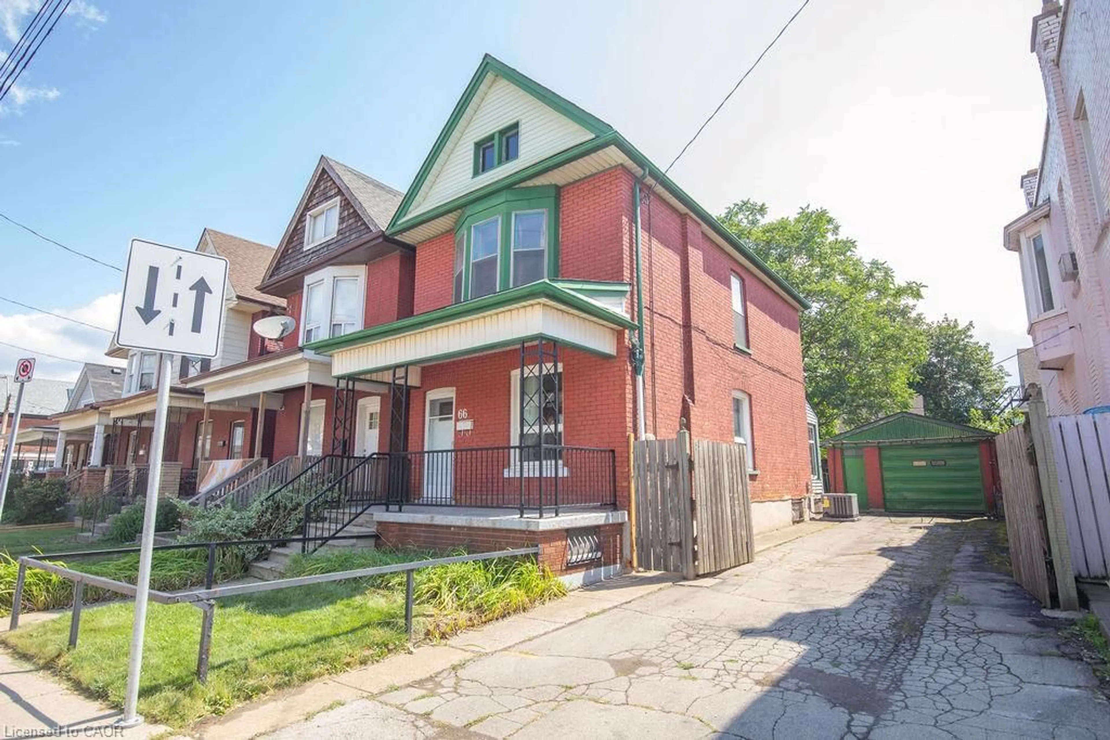 Home with brick exterior material, street for 66 Sherman Ave, Hamilton Ontario L8L 6M2