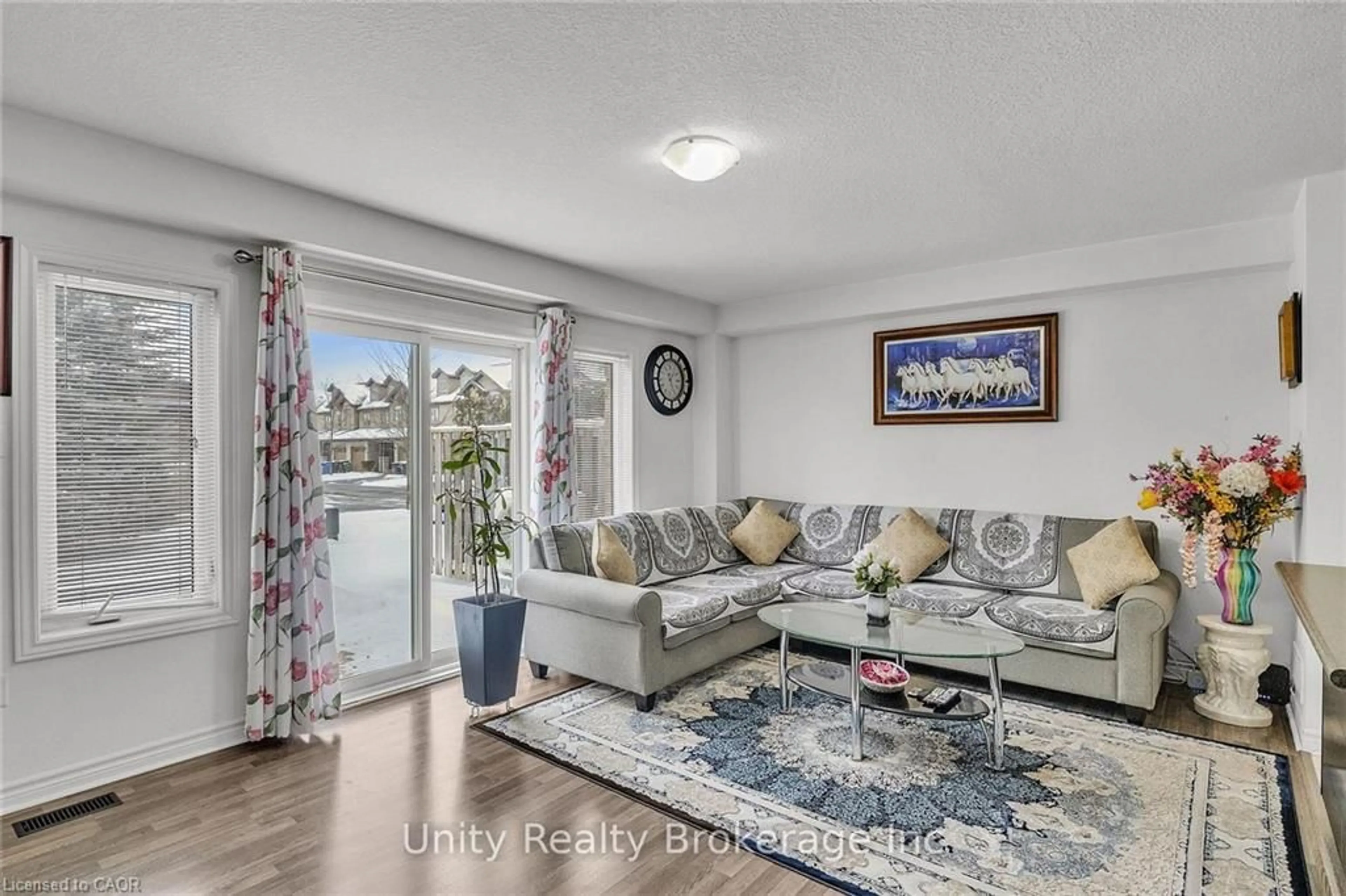 Living room with furniture, wood/laminate floor for 44 Arlington Cres, Guelph Ontario N1L 1C3
