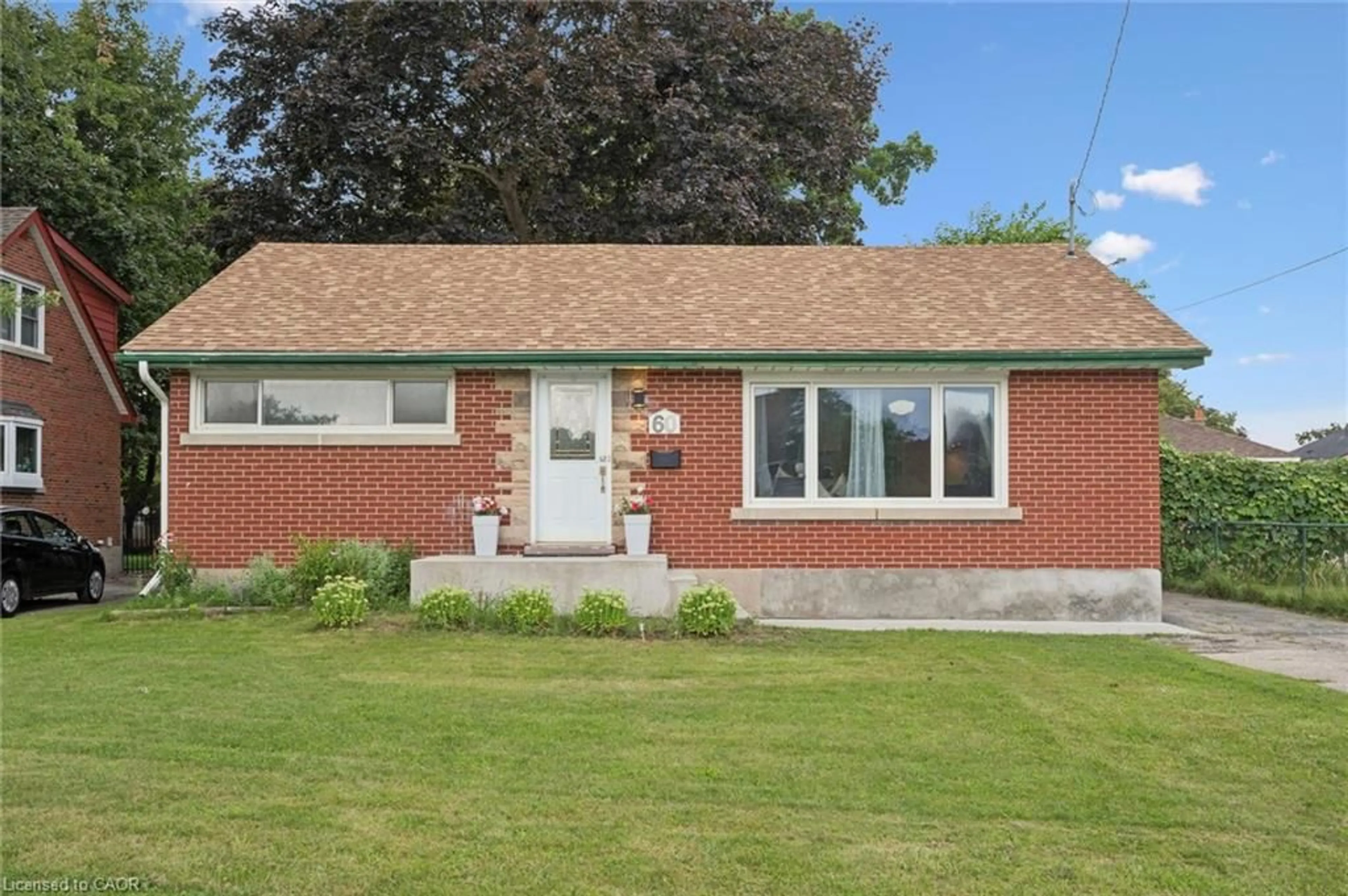 Home with brick exterior material, street for 60 Edinburgh Rd, Kitchener Ontario N2B 1M5