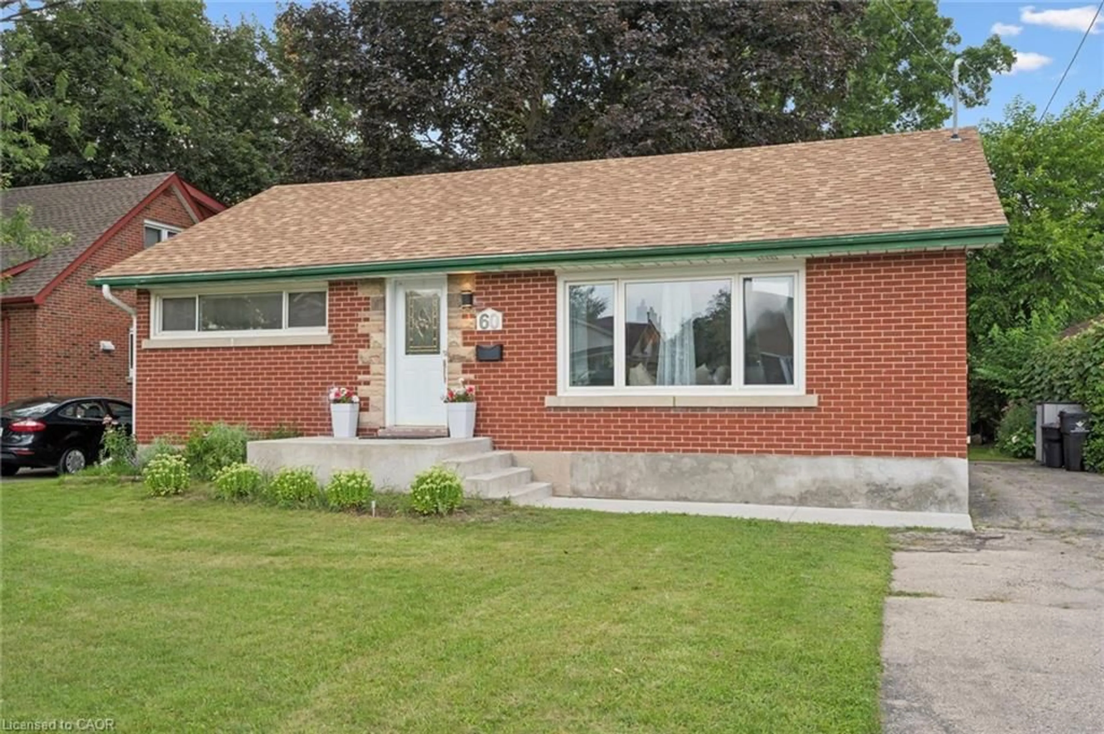 Home with brick exterior material, street for 60 Edinburgh Rd, Kitchener Ontario N2B 1M5
