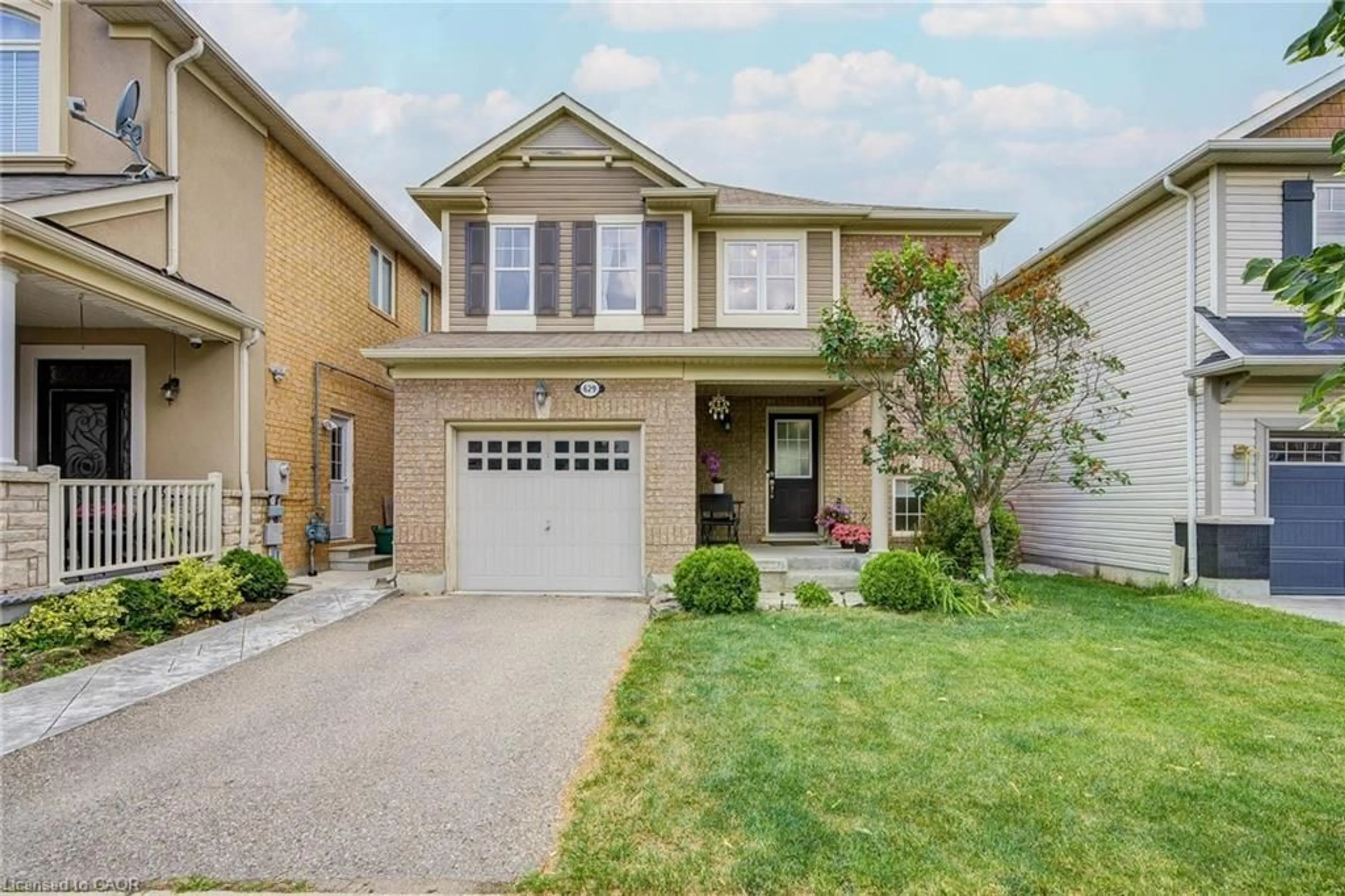 Home with brick exterior material, street for 629 Symons Cross, Milton Ontario L9T 7S2
