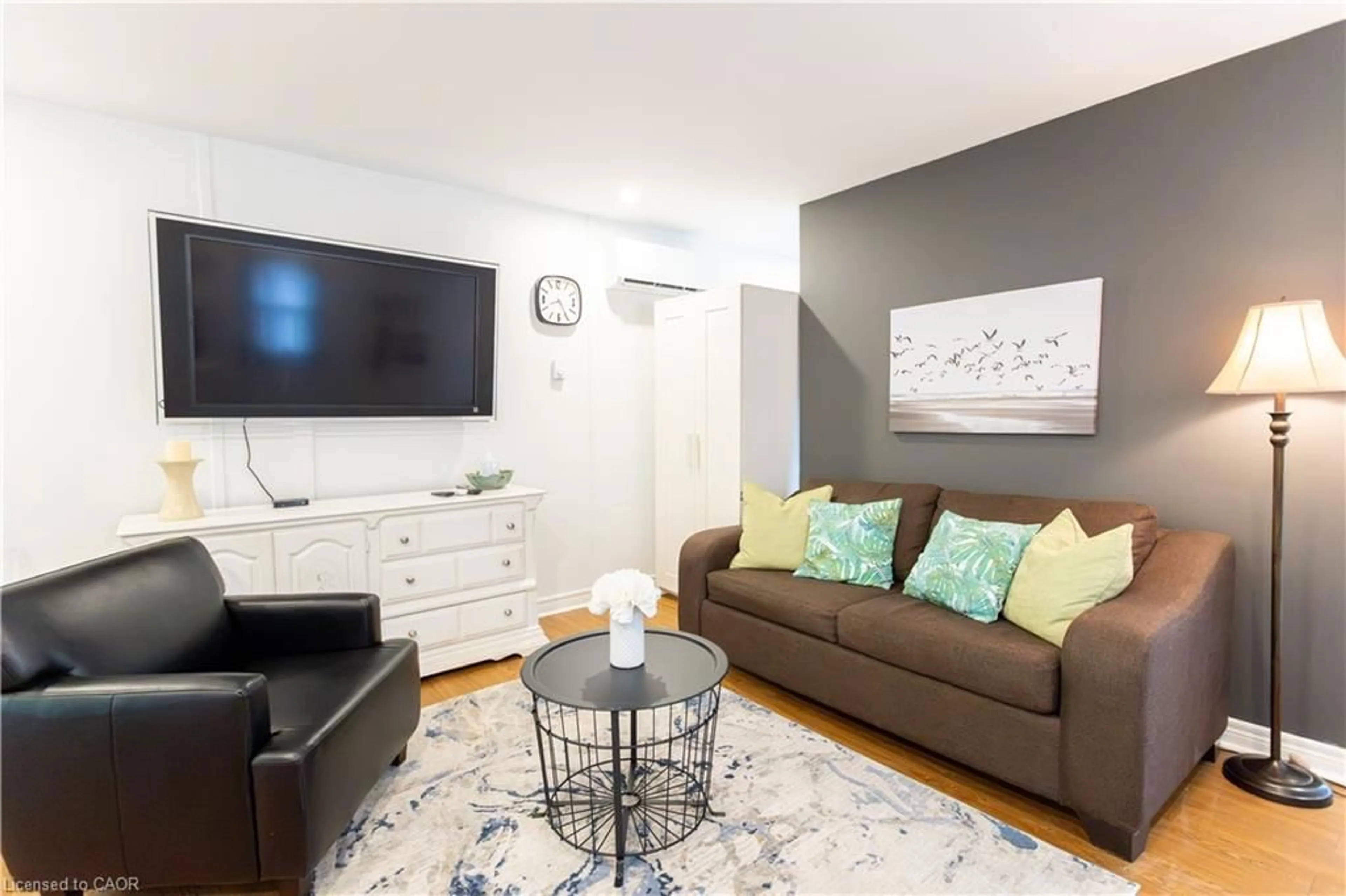 Living room with furniture, wood/laminate floor for 46 John St, Port Dover Ontario N0A 1N7