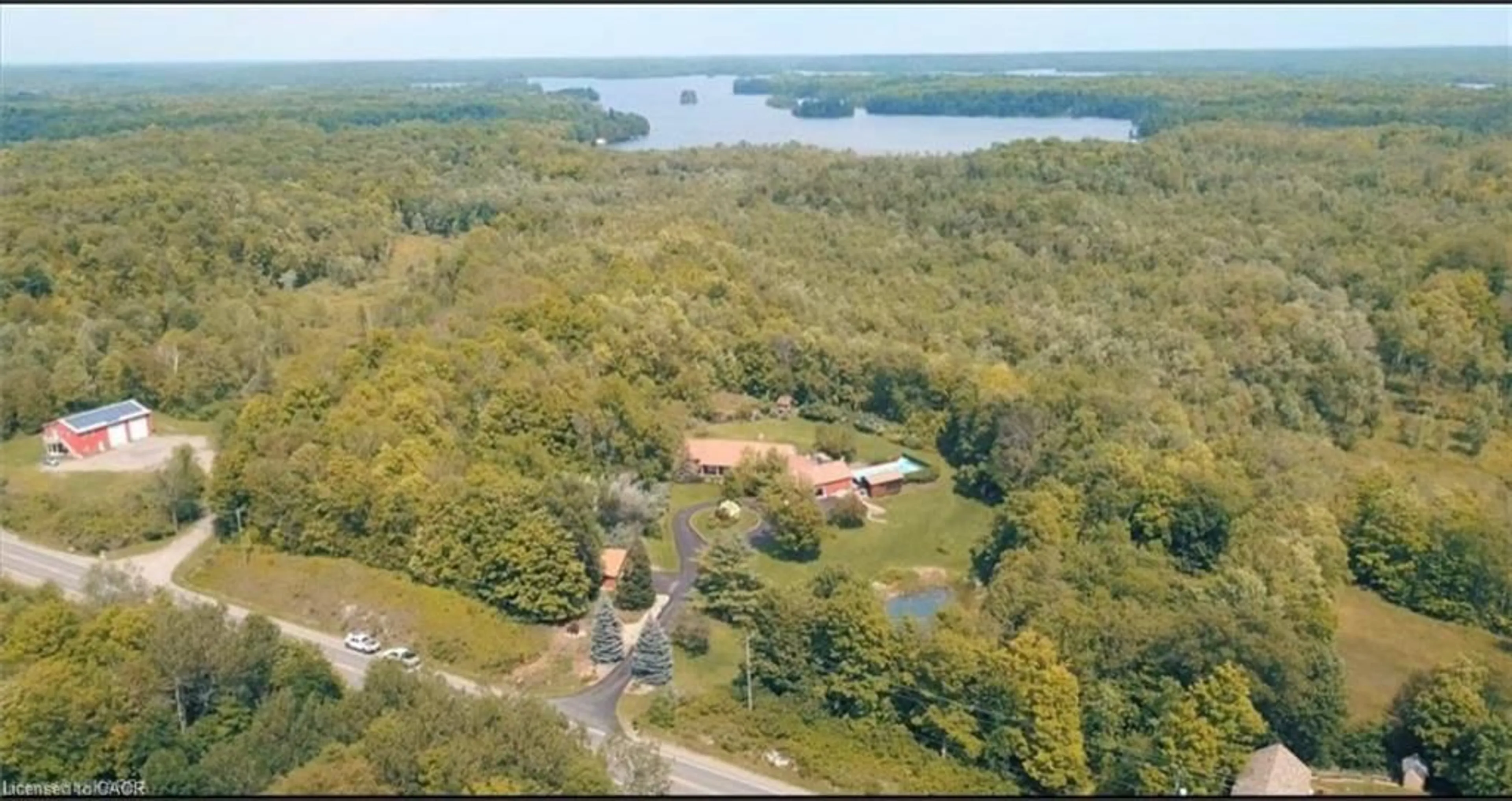 A pic from outside/outdoor area/front of a property/back of a property/a pic from drone, water/lake/river/ocean view for 13382 Highway 38 Hwy, Frontenac Ontario K0H 2P0