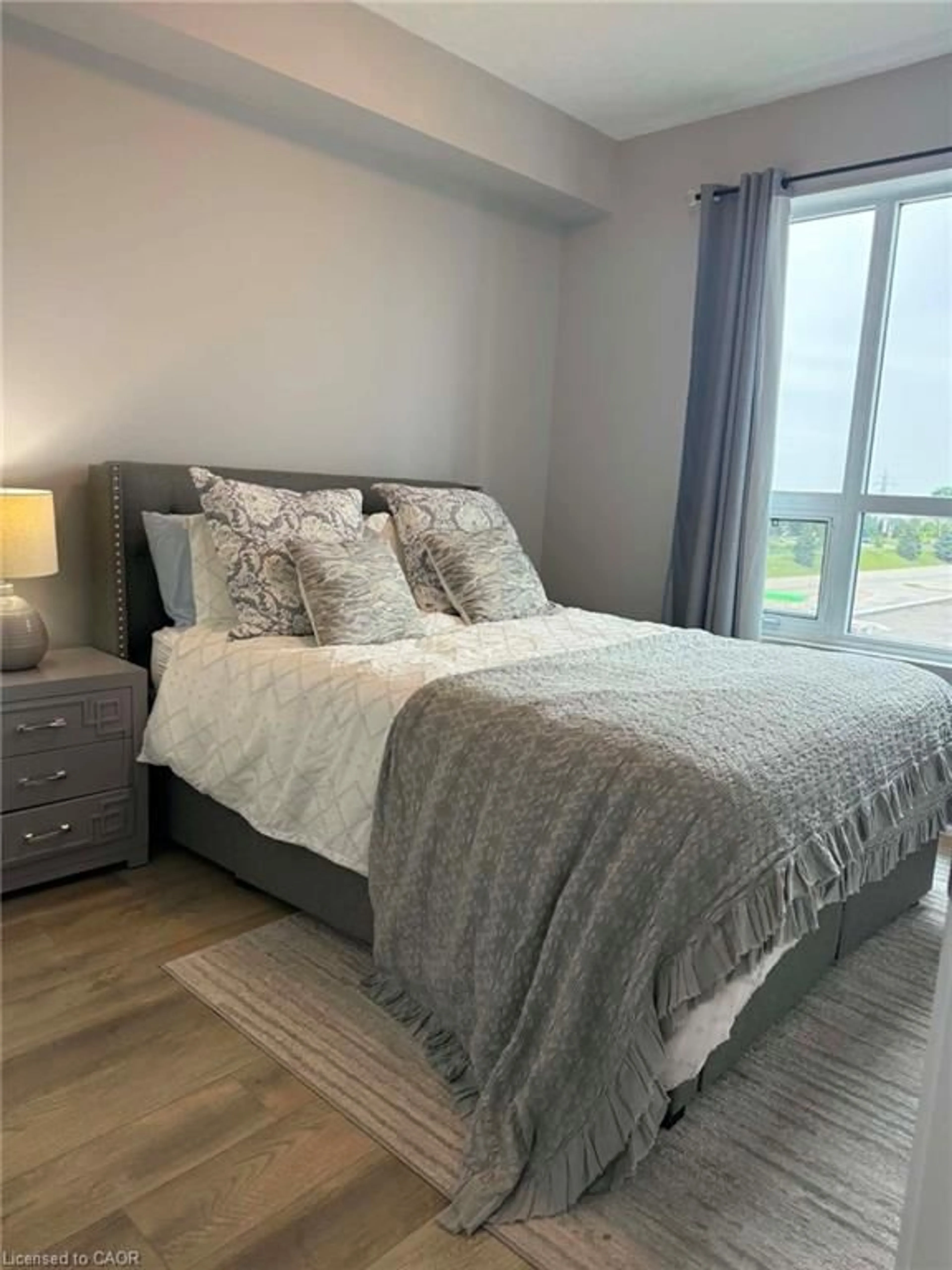 Bedroom with bed, unknown for 5055 Greenlane Rd #415, Beamsville Ontario L3J 2J3