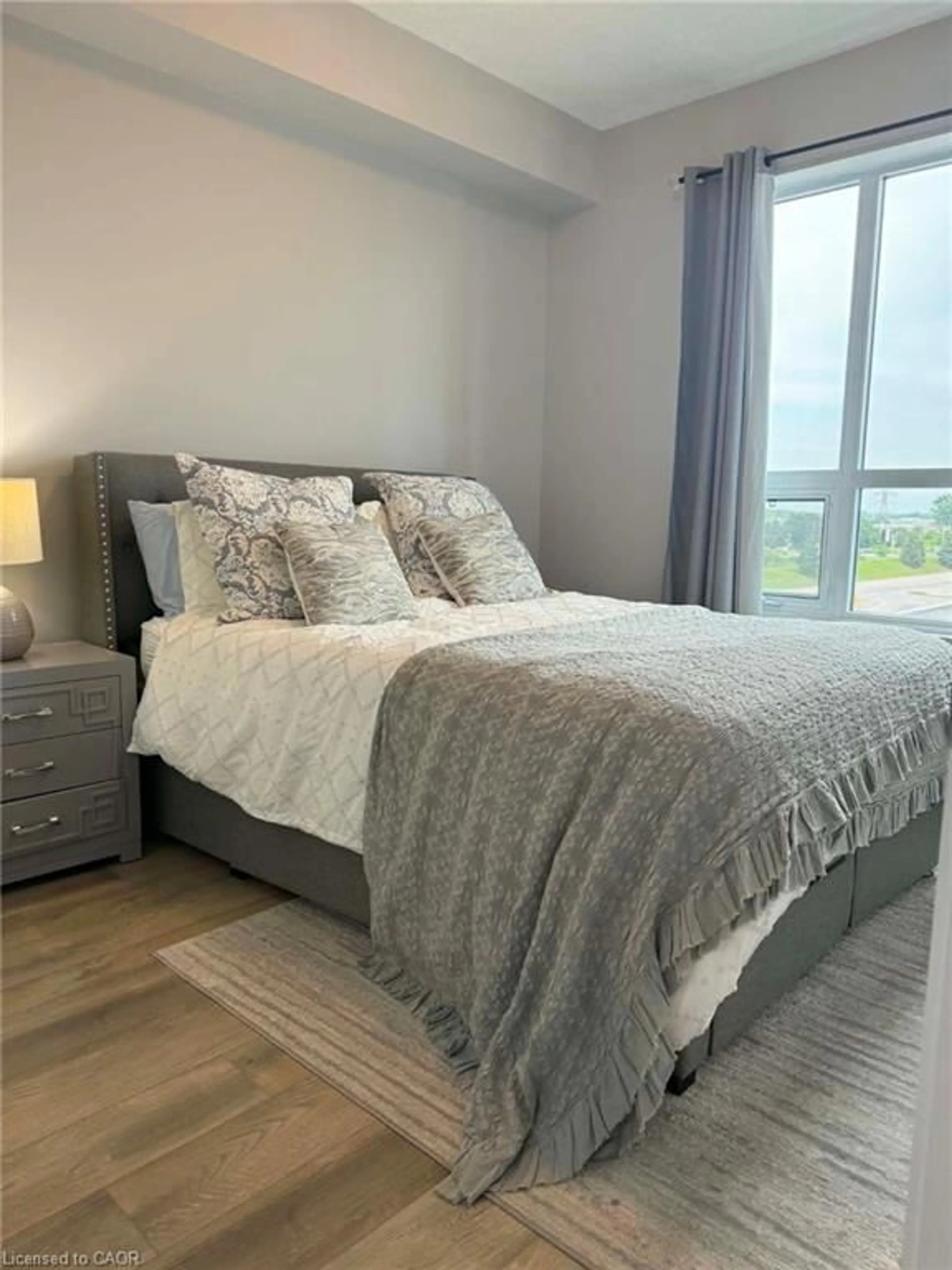 Bedroom with bed, unknown for 5055 Greenlane Rd #415, Beamsville Ontario L3J 2J3