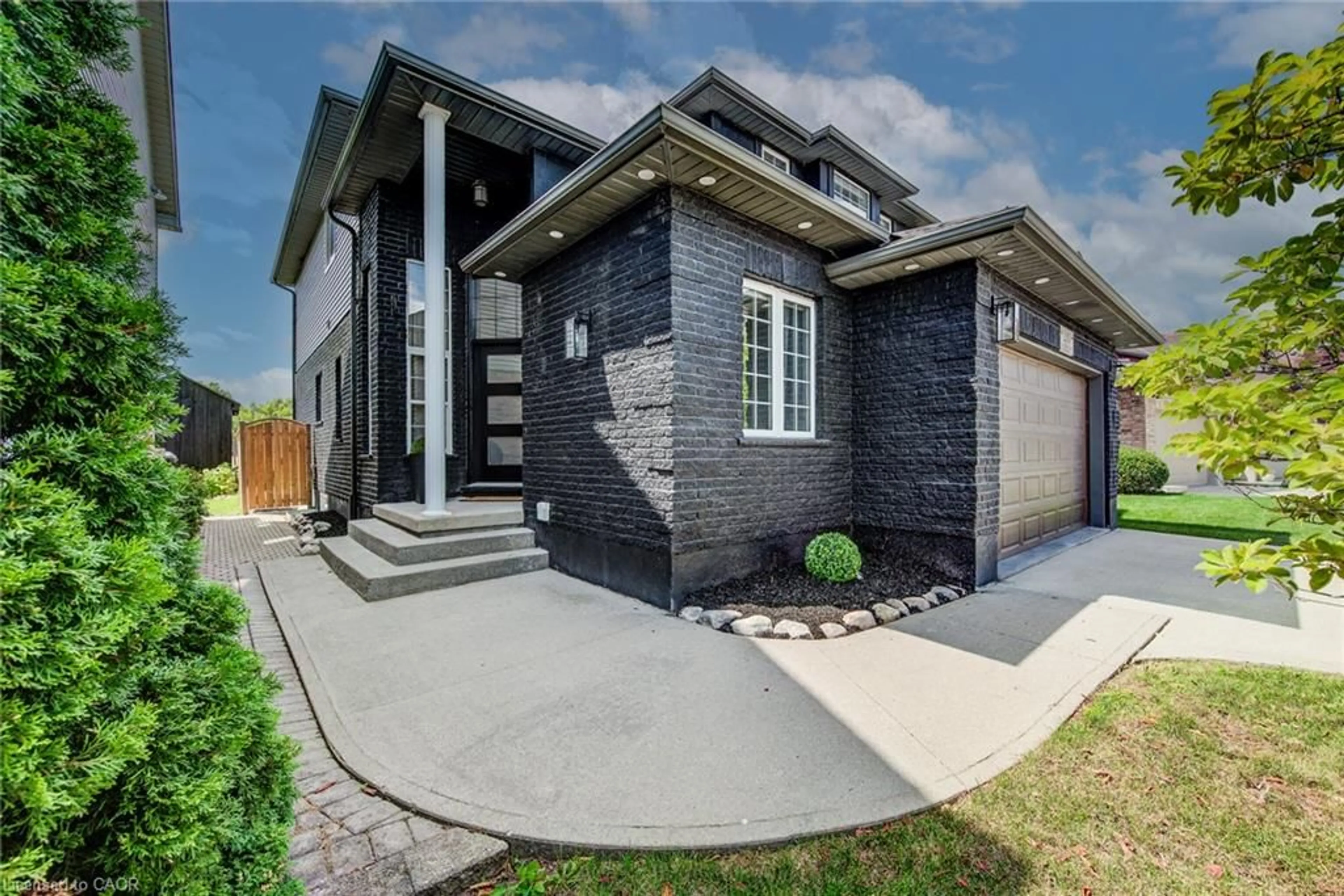Home with brick exterior material, street for 210 Hawkswood Dr, Kitchener Ontario N2K 4J3