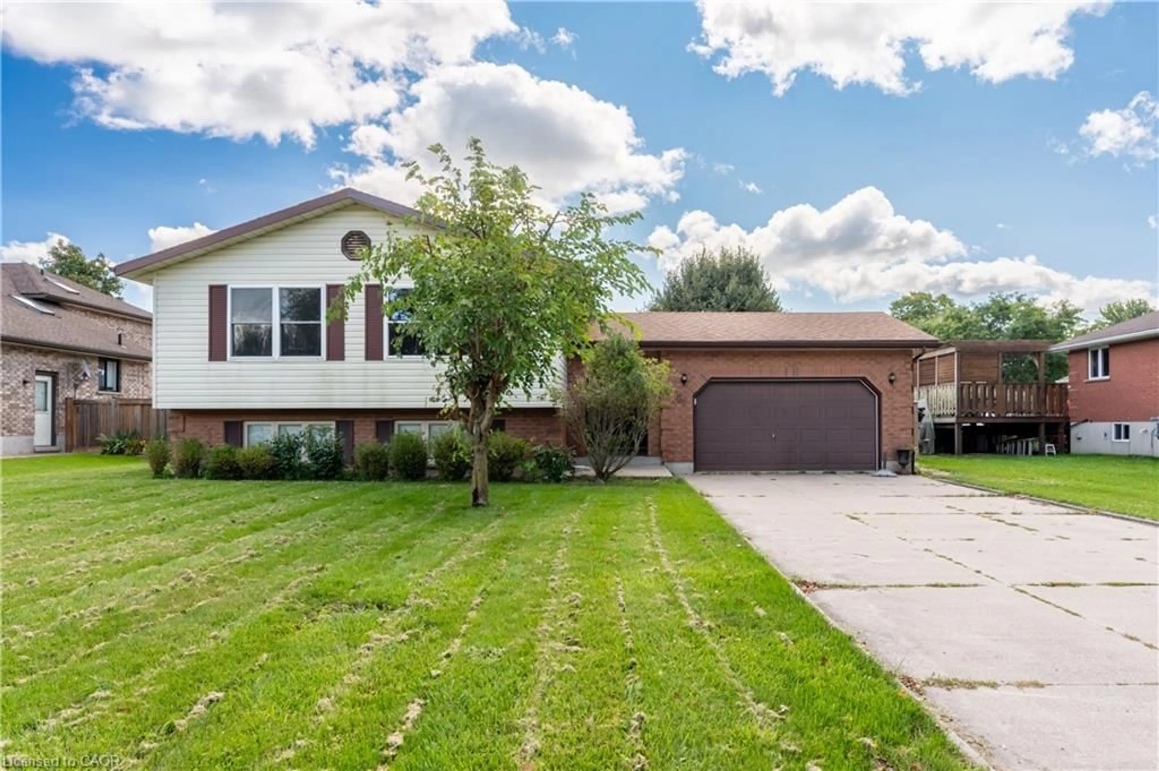 Home with vinyl exterior material, street for 69 Napier St, Mitchell Ontario N0K 1N0