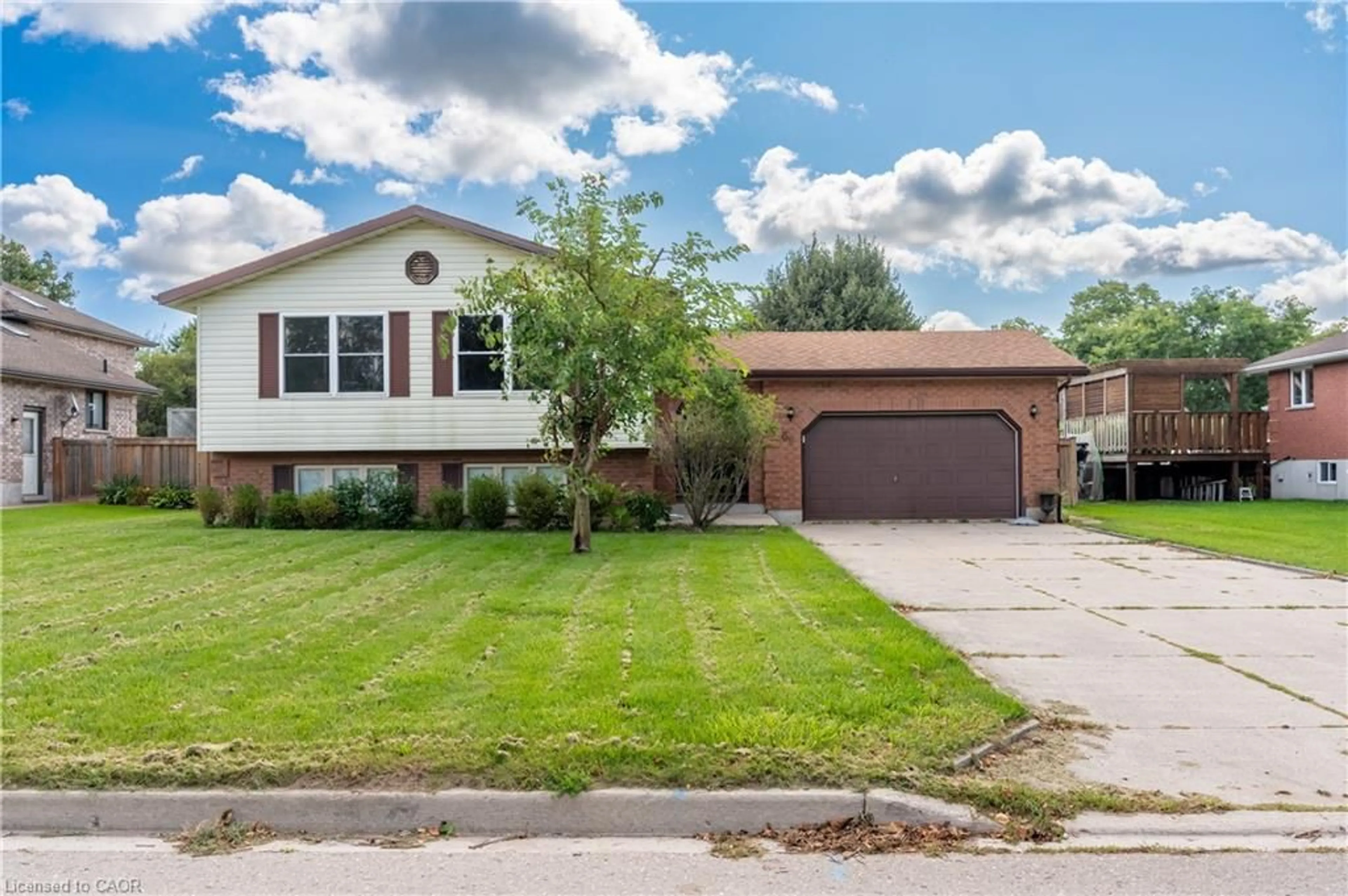 Home with vinyl exterior material, street for 69 Napier St, Mitchell Ontario N0K 1N0