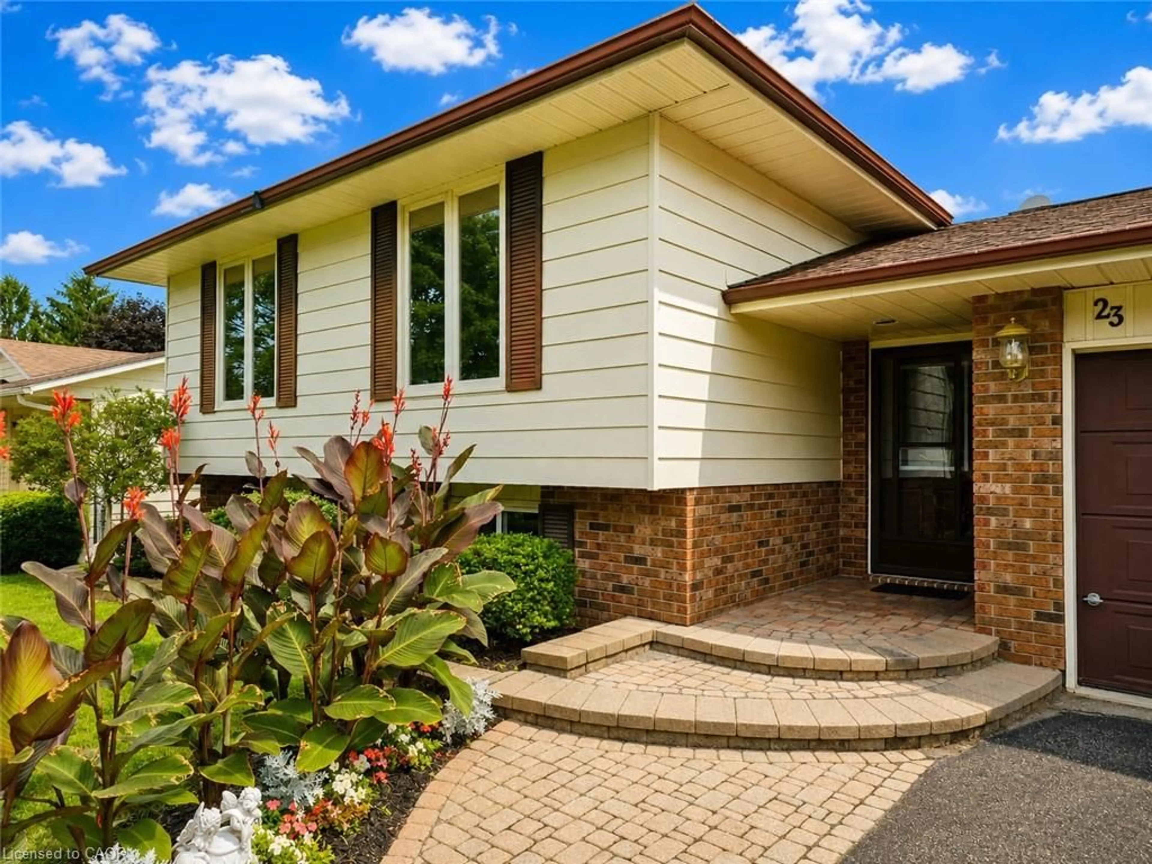 Home with brick exterior material, street for 23 Churchill Cir, Simcoe Ontario N3Y 4Z4