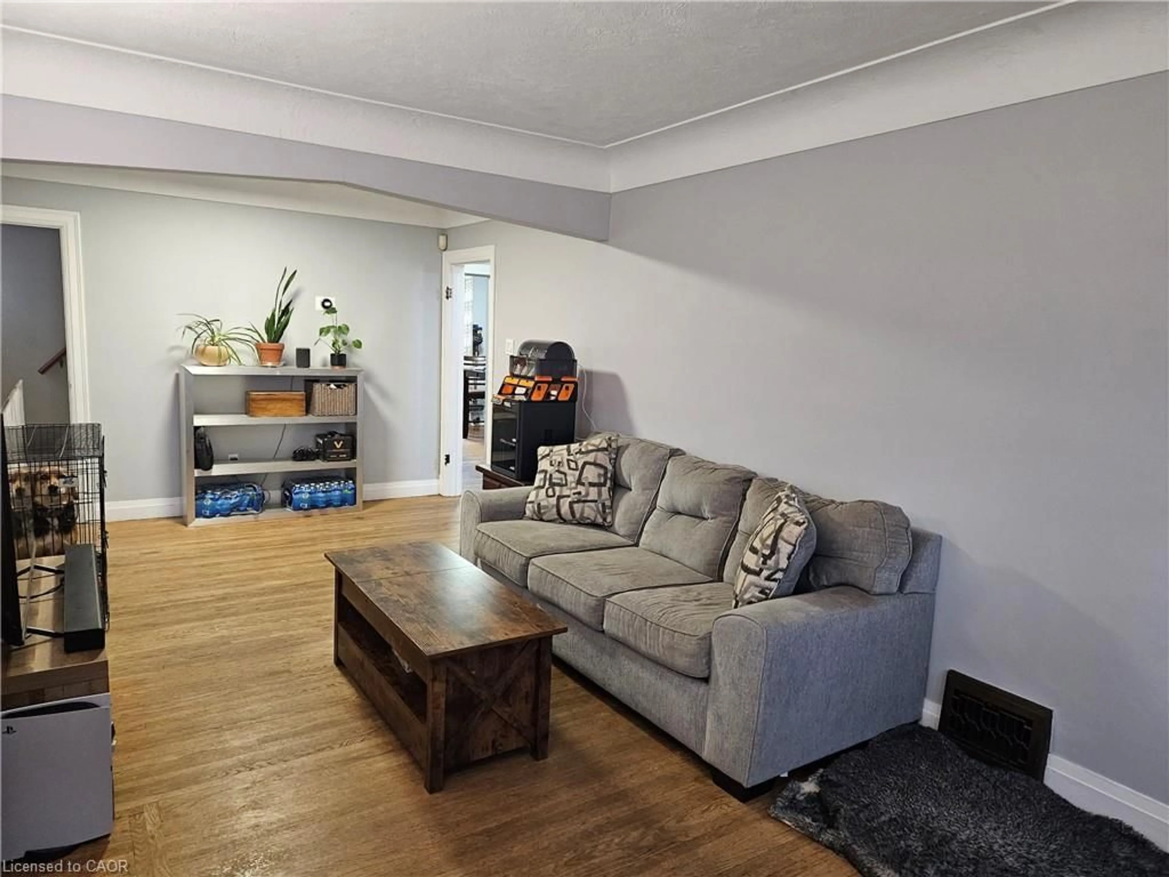 Living room with furniture, wood/laminate floor for 75 Barons Ave, Hamilton Ontario L8K 2Y4