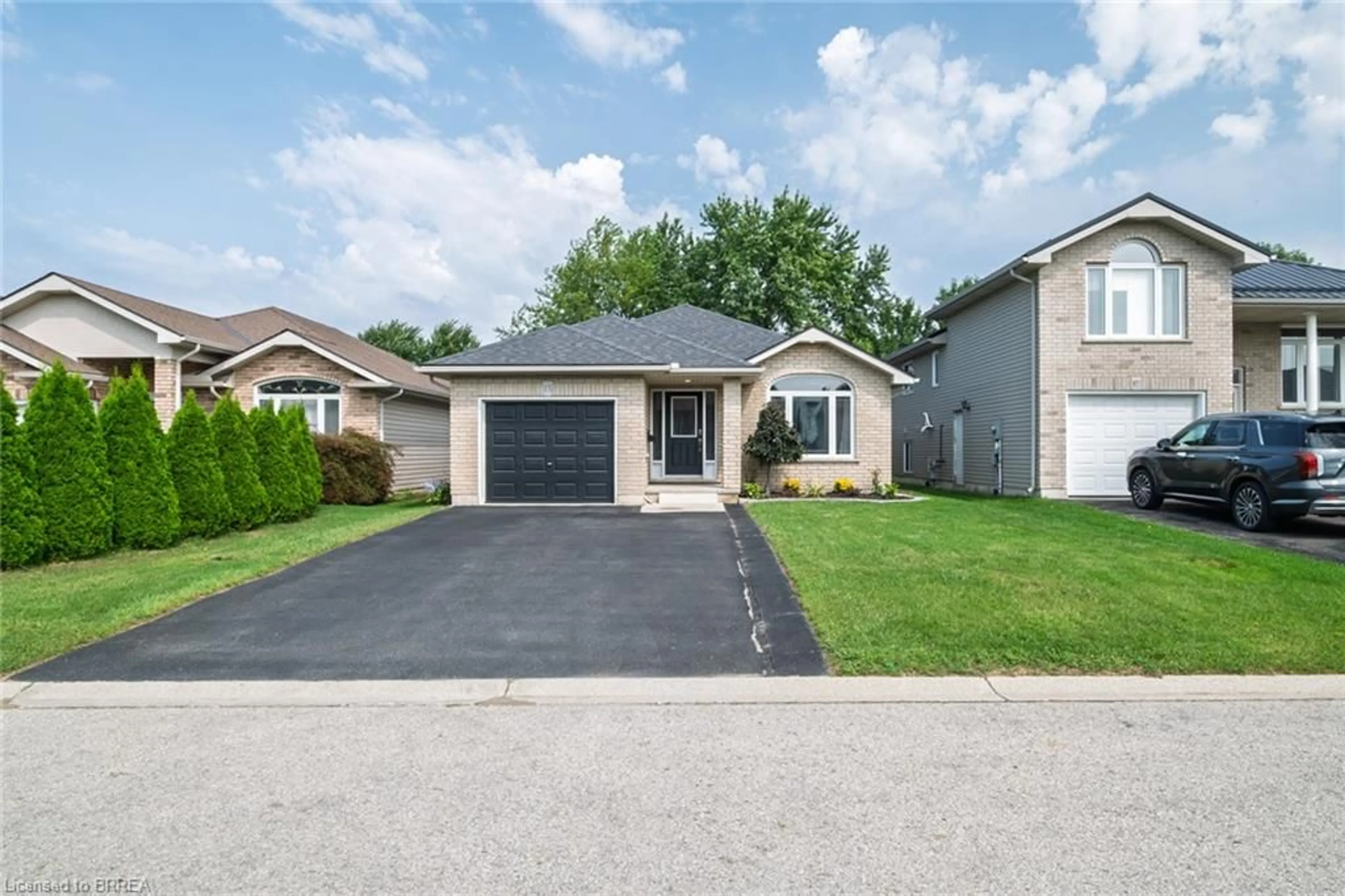 Home with brick exterior material, street for 15 Landon Ave, Simcoe Ontario N3Y 5J8