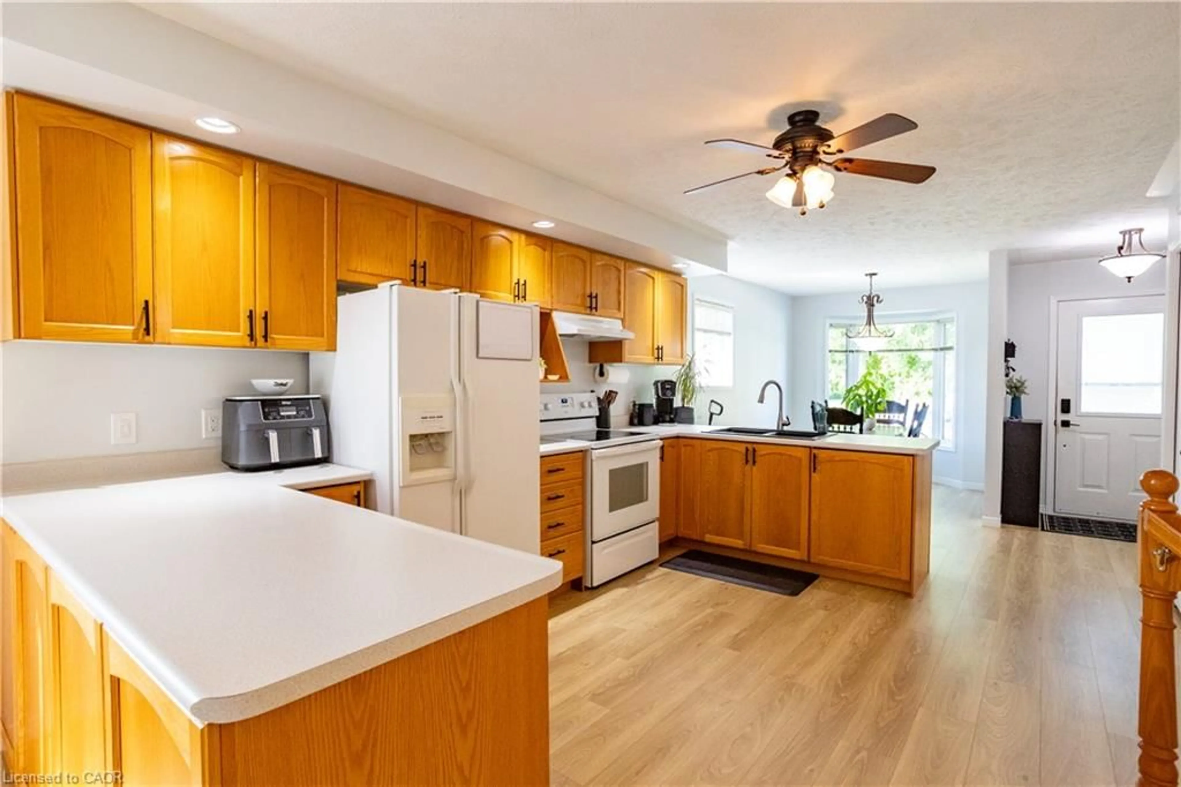 Open concept kitchen, wood/laminate floor for 536 St Andrew St, Port Dover Ontario N0A 1N0