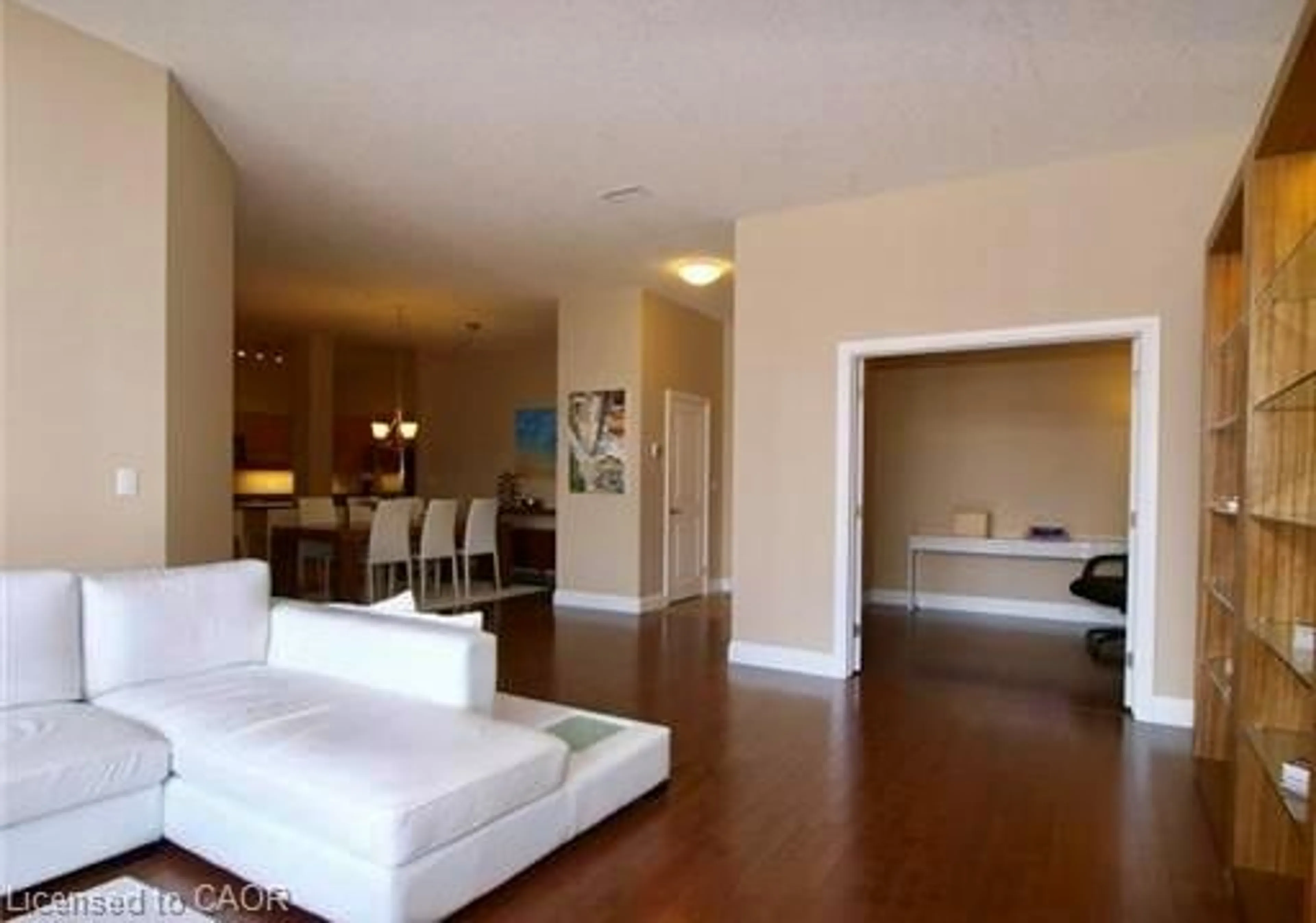 Living room with furniture, wood/laminate floor for 165 Duke St #309, Kitchener Ontario N2H 6T8